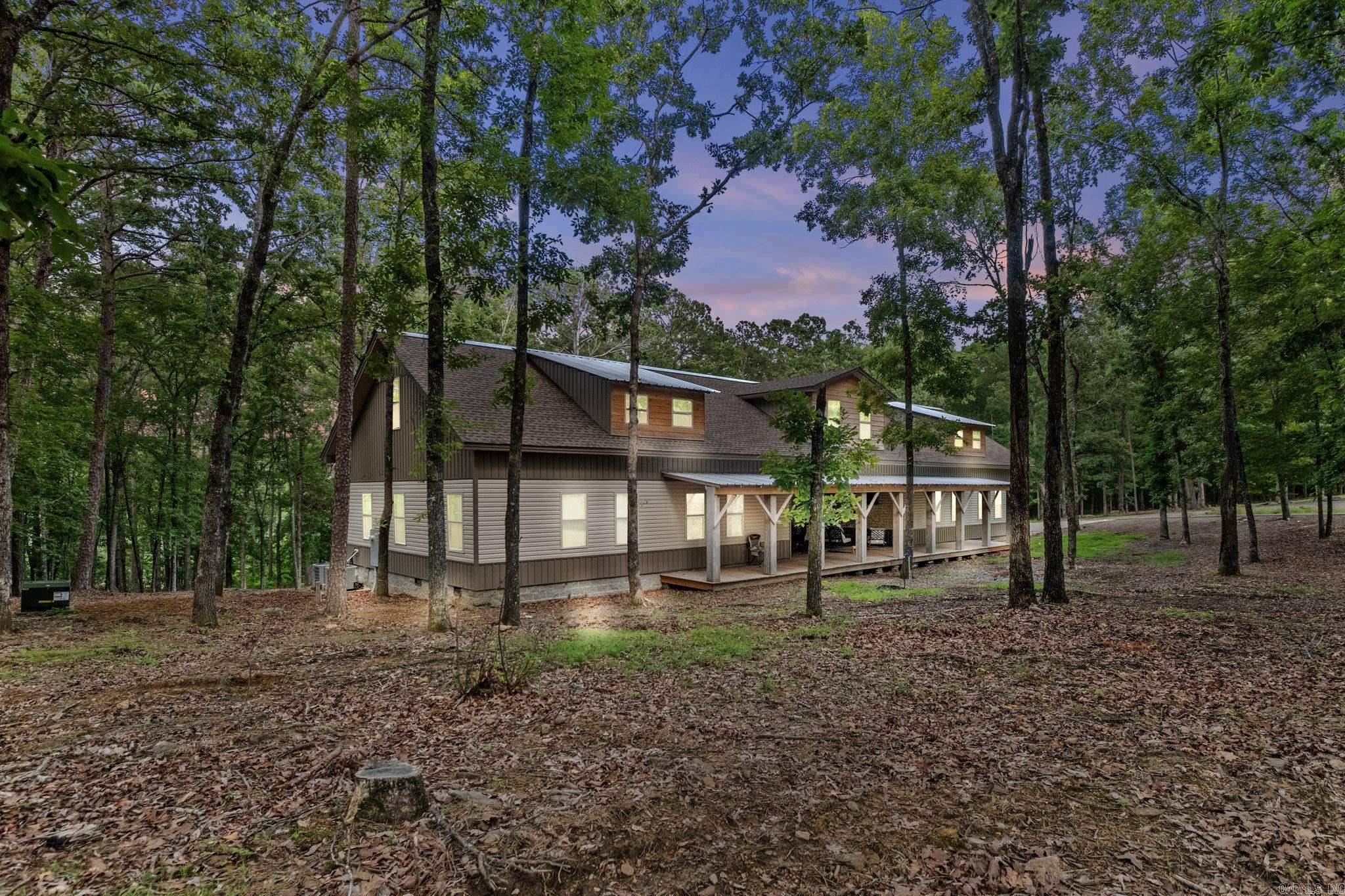 Like New LAKEFRONT home sitting on a large corner lot 200 feet from a community boat launch, several ATV trails and short golf cart ride to Tannebaum golf course. This lot is zoned for boat docks. Home includes: 5 Bedrooms, built-in bunk area, 3 baths, LVP flooring, granite countertops, stainless appliances, 2 laundry areas, 2 bonus/rec areas, 2 kitchen/bar spaces, large patio/porch, balcony with lake view and its own entrance. The garage is oversized for all your lake toys: 32ft wide X 40ft deep with garage doors 10 ft tall & 12 ft wide. The sellers keep their pontoon boat at the cove during times of use and pulls it into garage when finished. This home was built for entertaining and would make a great vacation rental. Selling fully furnished! Check out the virtual tour!