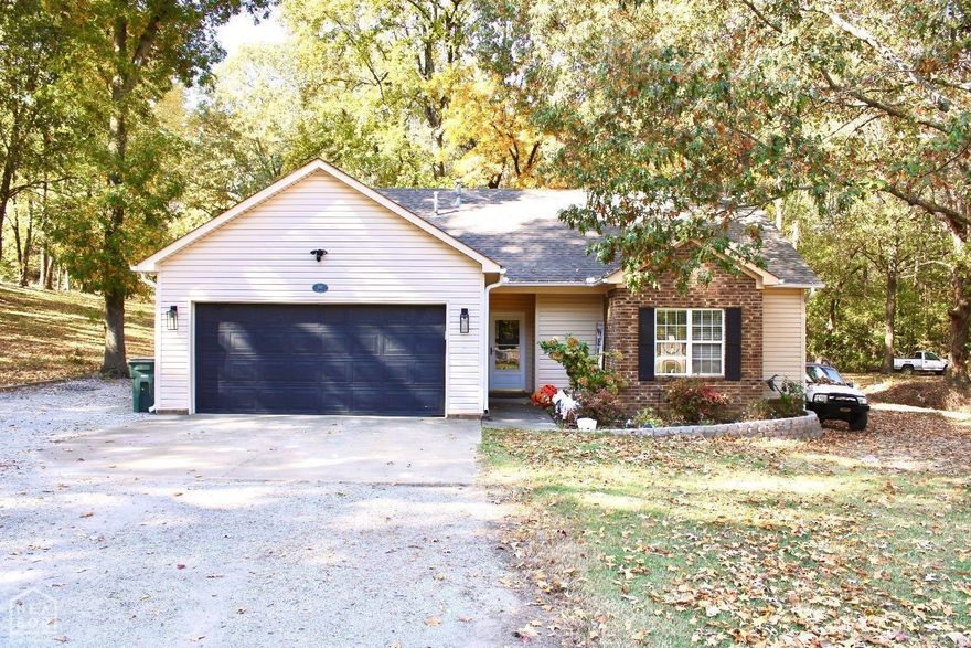 Nestled on a sprawling 1-acre lot, this exquisite home offers both the space and privacy you've dreamed of, complete with a stunning backdrop of natural beauty. The recent roof update, just 6 years ago, adds to the worry-free living experience this home offers. New siding in 2020 only enhances the exterior of this cozy home.  This meticulously updated residence boasts 3 bedrooms and 2 full baths. The heart of the home has been transformed with a kitchen remodel in 2020. Inside, you'll find a culinary haven equipped with a brand-new dishwasher and microwave (2024), ready to cater to your cooking adventures.  Comfort meets convenience with the latest in home technology. A new HVAC system installed in 2024 ensures your comfort in every season, while the Bluetooth garage door opener, Nest smart thermostat, and Ring camera doorbell with floodlight provide security and ease at the touch of a button.   But what truly sets this home apart is the newly added screened-in porch, complete with a luxurious hot tub. Imagine evenings spent soaking under the stars, surrounded by the tranquil sounds of nature. it's an experience that epitomizes relaxation and privacy. Schedule your showing now!