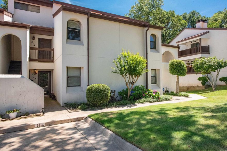 Located in an exceptional neighborhood, this 2 bedroom, 2 bath condo has a lot to offer.  Updates in the last 5 years include Swedish soft close cabinets in the kitchen, granite countertops, wood floors, appliances and partial renovation of downstairs bath.  HVAC replaced in 2022.  The living area features a cozy wood burning fireplace with high ceilings and is open to the kitchen and dining areas.  This unit backs up to the greenspace and you can sit on your private balcony and enjoy the view of the trees.  Or you can grab a towel and enjoy the refreshing pool.  Condo association fee covers exterior maintenance, insurance, termite, water/sewer, trash and swimming pool. Close to amenities such as grocery stores, clothing stores, restaurants, etc.  Appliances conveying includes stove, refrigerator, dishwasher, microwave, washer and dryer.  Includes one designated parking spot directly in front of the unit with additional parking available for guests. This one is ready to move into immediately.  Make your appointment today before it’s gone. Please see agent remarks.