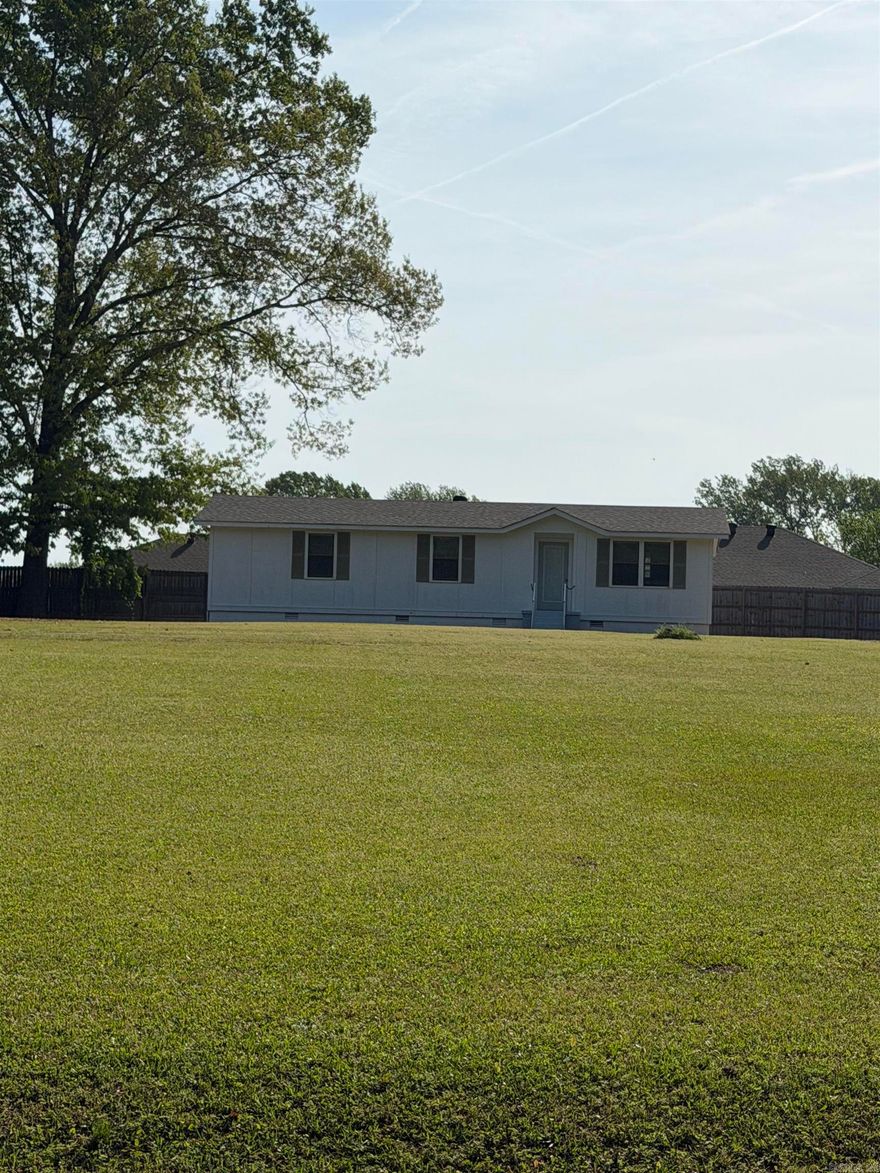 Country Setting with 1.55 Acres and outside city limits.  Modular home offers permanent foundation, 3/2, updated HVAC & Electric Water Heater, some new Interior paint & kitchen appliances and outbuildings.  Property has lots of outbuildings for storage areas: 30x30 shop w/electricity, WI doors and 2 other areas offers storage places. Please see agents remarks for 2nd property option to purchase.