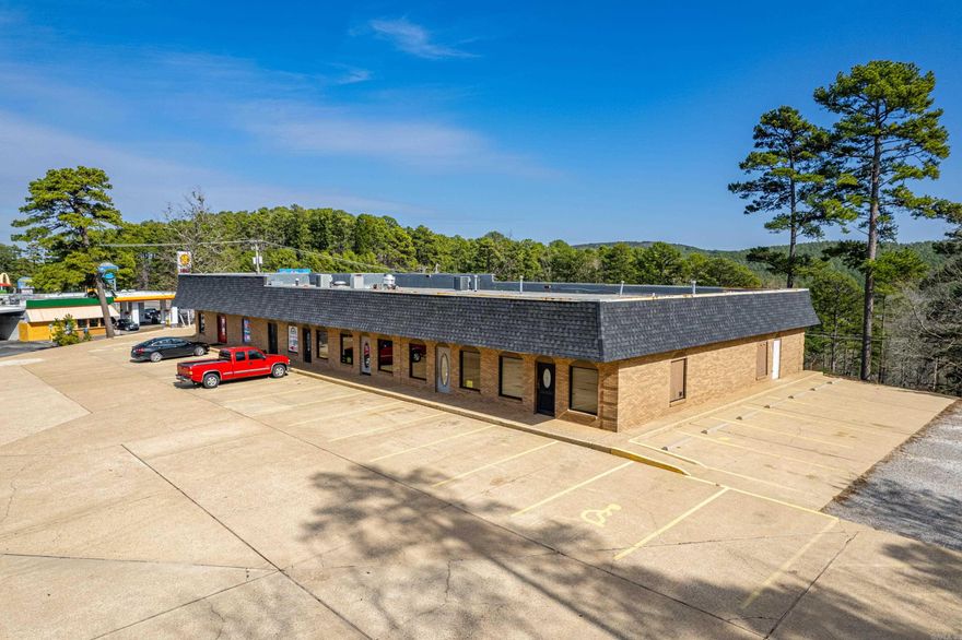 Commercial space available on Highway 7 North just south of the HSV West Gate entrance! High traffic area! Call for details on this amazing investment opportunity! All 4 spaces are currently connected inside. The restaurant is currently leased and does not have access to the remaining 3 spaces, all of which were leased to one tenant previously. They can easily be separated and leased individually. Perfect for office space, salon, bakery, medical office, builder's showroom, boutique, resale shop, florist, the possibilities are endless! Level parking with room to expand is accessed from McNeely Circle. Adjoining additional acreage and buildings are available to be purchased separately!