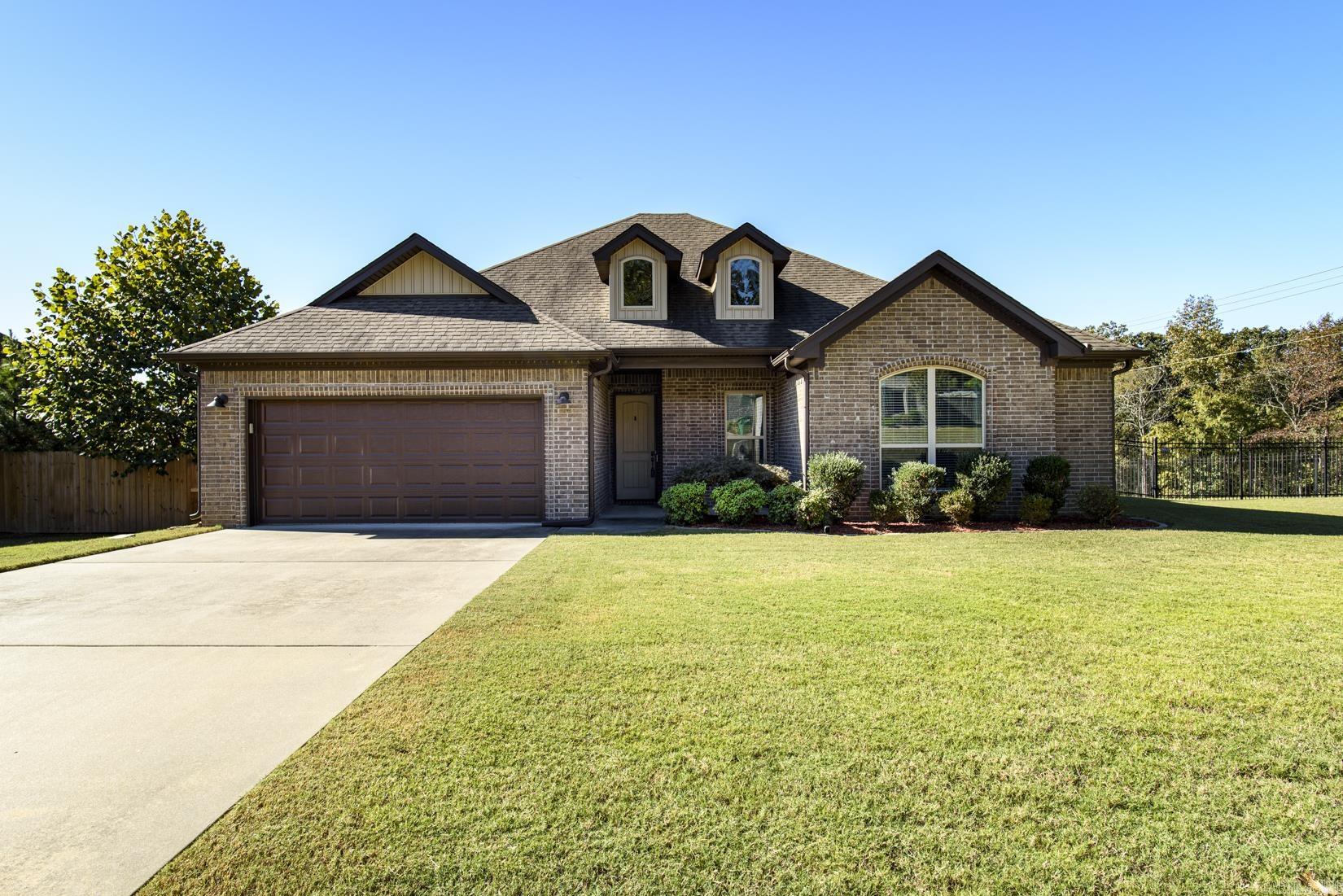 Fabulous One-Level Home in Lochridge Estates! Welcome to this beautiful 4-bedroom home located in the gated community of Lochridge Estates in West Little Rock. This one-level home offers an inviting open layout and timeless finishes throughout. The spacious great room features a cozy gas log fireplace and flows seamlessly into the gorgeous kitchen, complete with granite countertops, stainless steel appliances, a gas cooktop/stove, breakfast bar, and a generous breakfast areaāperfect for casual dining.The primary suite is a relaxing retreat showcasing a wood tray ceiling, walk-in closet, jetted tub, an d a separate shower. Three additional bedrooms provide plenty of space for family, guests, or a home office. Step outside to enjoy a covered patio and open deck overlooking the large, fenced backyardāideal for entertaining or simply taking in the peaceful surroundings. Agents please see remarks.