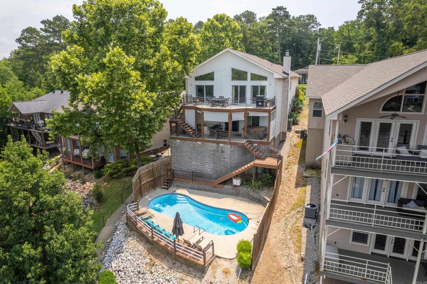 Investors Take Notice! This 4 Bedroom 3 Bath home is already one of the top producing nightly rental properties on Lake Hamilton. Theinterior of this home includes a spacious family room with fireplace, striking kitchen and baths, great size guest rooms and multiple livingareas. The exterior boasts a beautiful in ground pool, hot tub, single stall boat dock, double car garage and much more! This homewould also be a great weekend option or a family looking to live on Lake Hamilton!