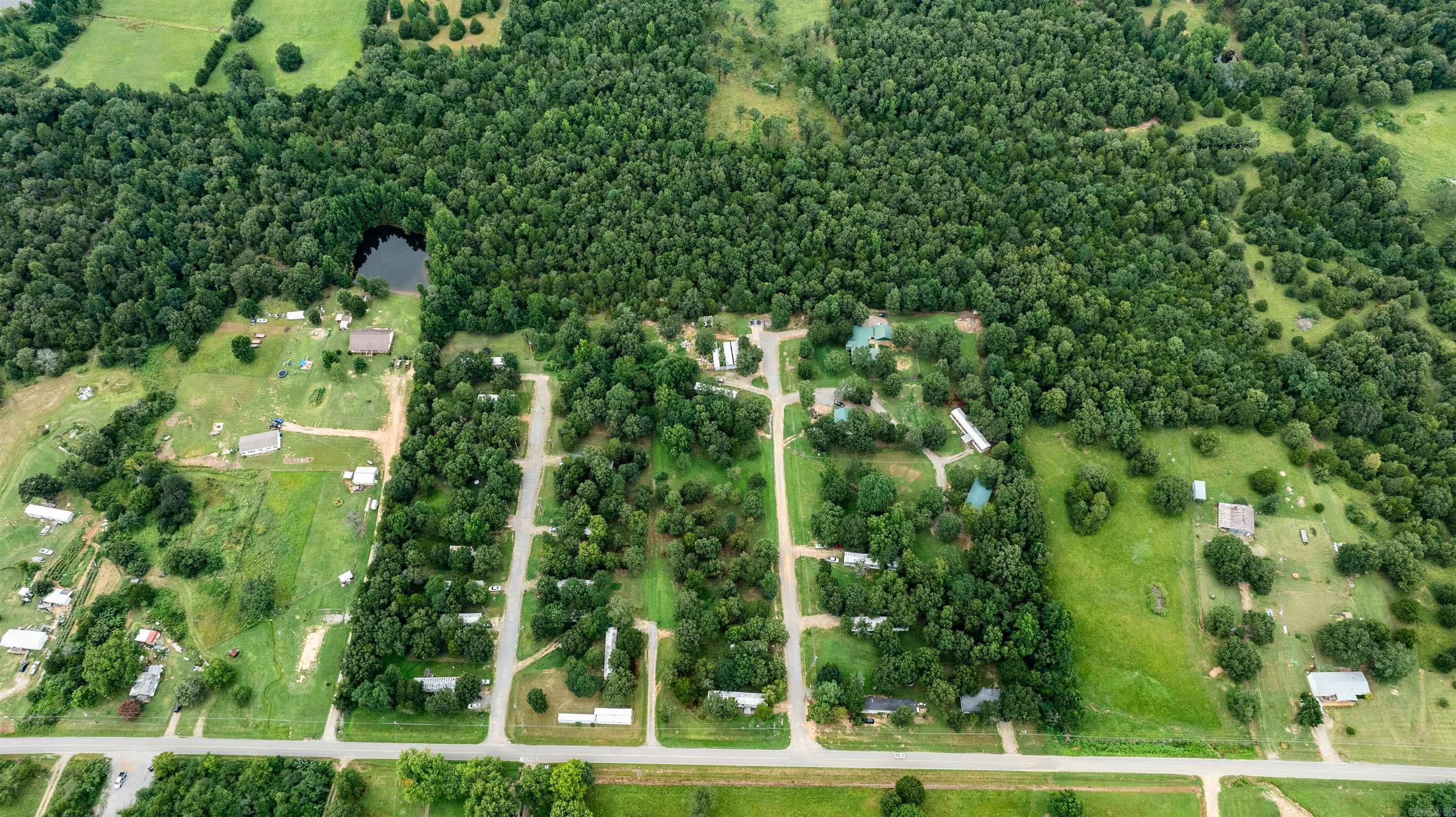 Mobile Home Park Investment Opportunity Welcome to a prime investment opportunity with this 23-pad mobile home park, sprawling across a generous 15-acre lot. This park presents a golden chance to add significant value and growth potential. With ample space to expand and add more units, investors can capitalize on the increasing demand for affordable housing. All homes in the park are park-owned, with tenants responsible for paying their own utilities, simplifying management and reducing overhead costs. Current rents offer room for adjustment to align with market rates, providing an immediate avenue for revenue enhancement. Additionally, operational expenses can be optimized, further increasing profitability. The park features a blend of well-maintained lawns and shade trees, creating an attractive and comfortable living environment for tenants. Positioned away from the homes, these green spaces offer a serene retreat within the community. Conveniently located close to shopping centers, entertainment venues, and commercial hubs, this mobile home park ensures easy access to essential amenities and leisure activities, making it a desirable location for residents. See Agent Remarks