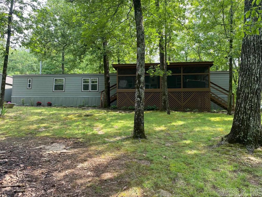 This is a jewel of a place!  Mobile is in great shape and clean clean!!! Property boasts a screened in front porch with deck on the back, creek in front yard, RV hook-up, 2 sheds, aluminum carport and space!!!! Excellent property for weekend home close to Dam Site Marina, Old Hwy 25 and Heber Springs.  Lots of room for all the lake toys. Washer, Dryer and some furniture will convey with reasonable offer. Property is priced to sell!!!
