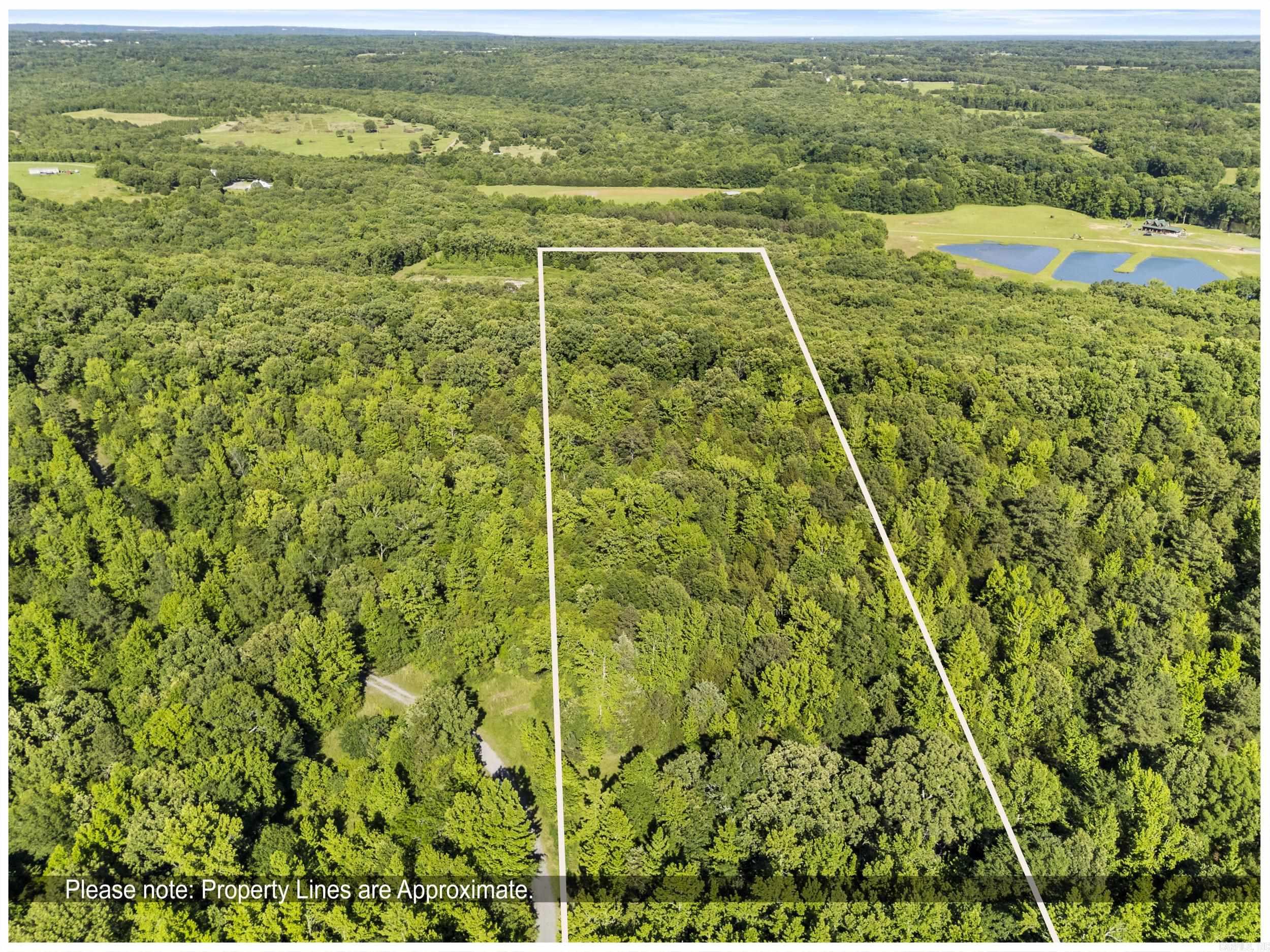 Enjoy peaceful country living just minutes from town on this stunning 3-acre property in Searcy, AR. 2 year old oad leads to the top of the lot, offering panoramic forest views and a cleared, build-ready site—perfect for your dream home or cabin. Features include a sturdy stick frame lean-to with awning for storage or gatherings. Don't miss this rare opportunity to own scenic land with easy access and endless potential.