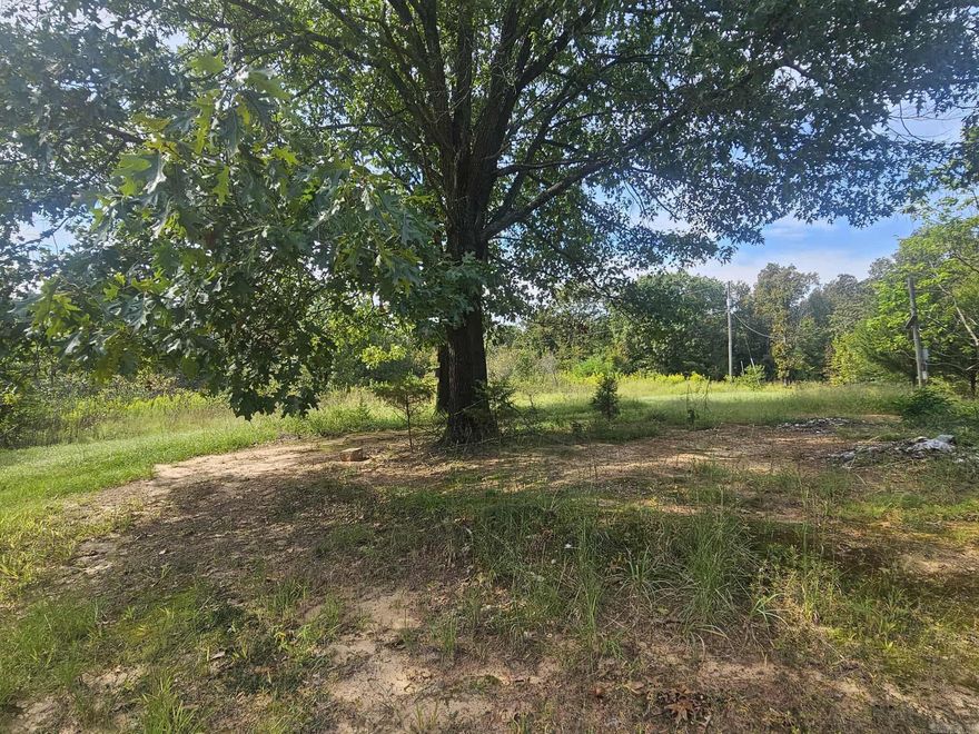 Attention Investors & Developers! Don’t miss this opportunity — 4.99 acres with 3 electric meters, 3 water meters, and 2 septics already on the property! Being sold AS-IS. No restrictions! Utilities will need to be inspected. Secluded and peaceful- yet only 10 minutes from town. Endless potential for development, rentals, or a private retreat!