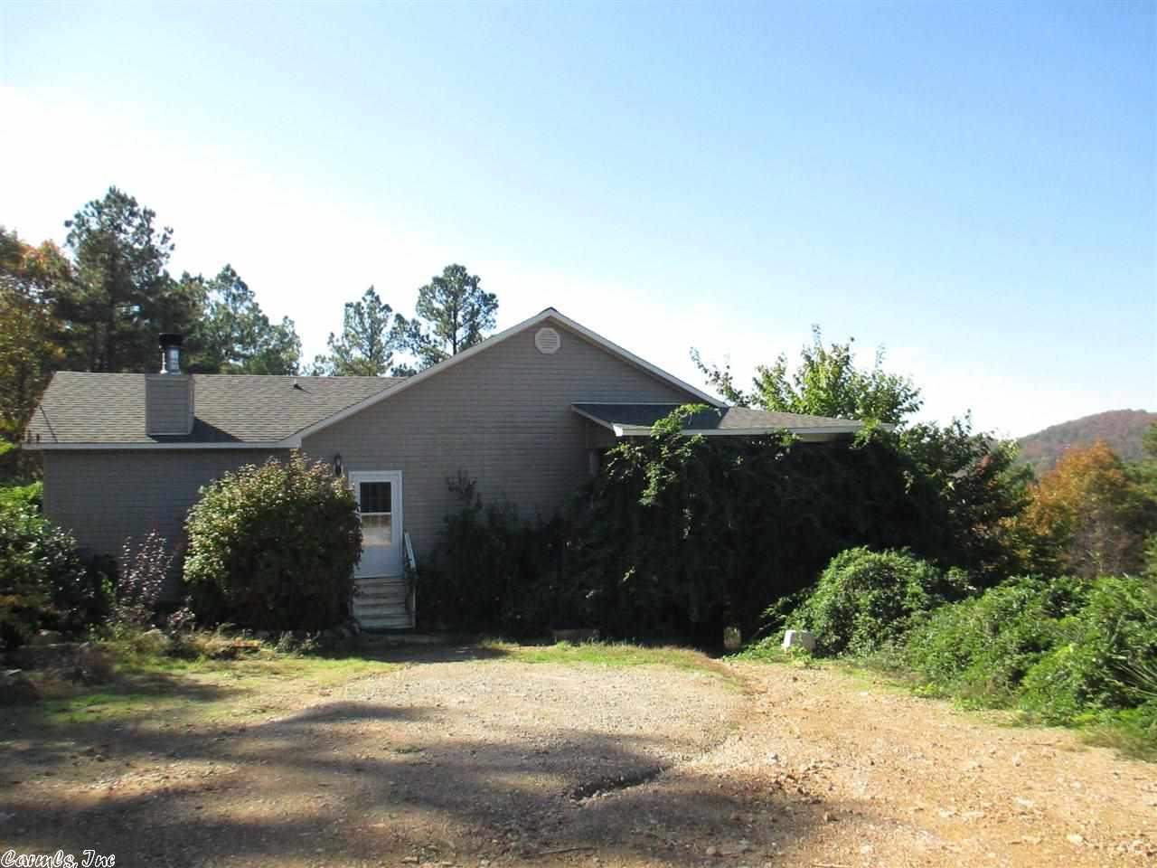 Driveway is washed out. Do not attempt this in a car only truck or SUV. Health forced SHORT SALE. Over 2100 sq. ft. needs work. Flooring, paint, all exterior painted surfaces need painting. Driveway needs grading, all shrubs need pruning or removal. Home offers 2 living area, split floor plan, wrap around porch with a magnificent view of mountain summit. This could be a fantastic, private, escape or retreat. Bargain priced. Buyer is responsible for turning on utilities for inspection. Property sells "AS IS"