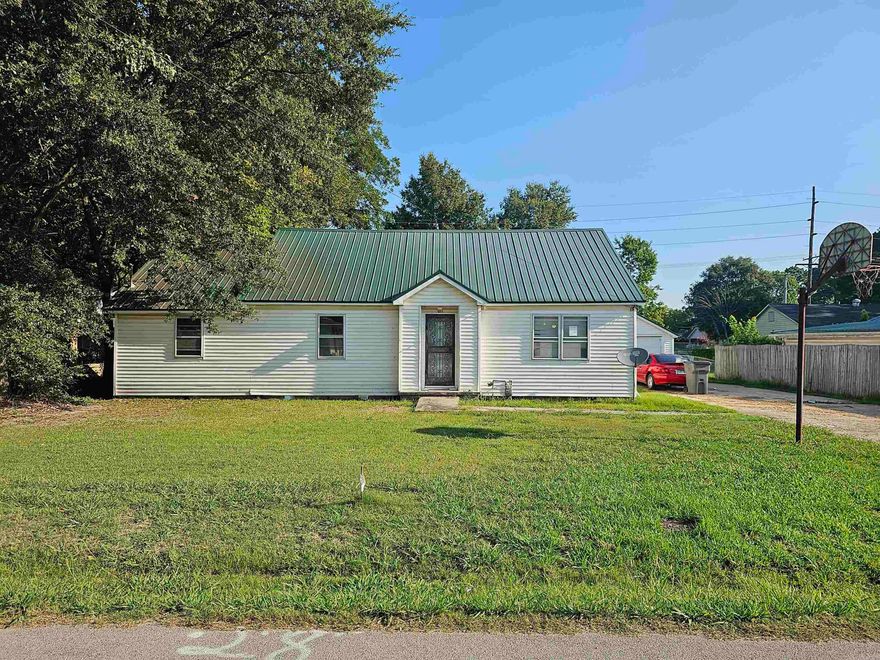 Attention Investors! This 3 bedroom, 1 bath home has excellent potential! With some TLC, this would make a great rental or flip! This home has a metal roof, detached garage, large laundry room and a quarter acre lot (+/-). Give us a call for your tour today! Being sold AS-IS, where-is.