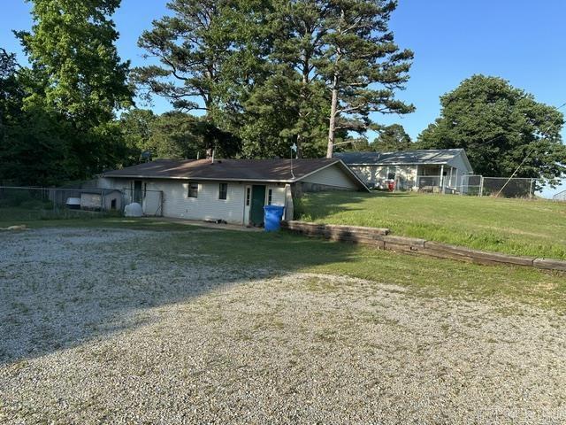 This property has two homes located on it sitting on 4.09 acres total assessed under the same parcel! The second home at 9933 Hwy 412 W offers 2 beds and 2 baths, 1,196 sq/ft and the roof is approximately 2-3 years old. Both homes offer gas stoves and have central AC. There is a 40x40 camper shed with electric, 28x50 shop with electric and water (water not currently turned on) inside this shop there is a small kitchen, toilet and laundry area, 30x30 shed with electric, and a barn with three stalls. This home is associated with MLS 25024007 listing and can be lot split. If both homes are sold together price is $270,000.