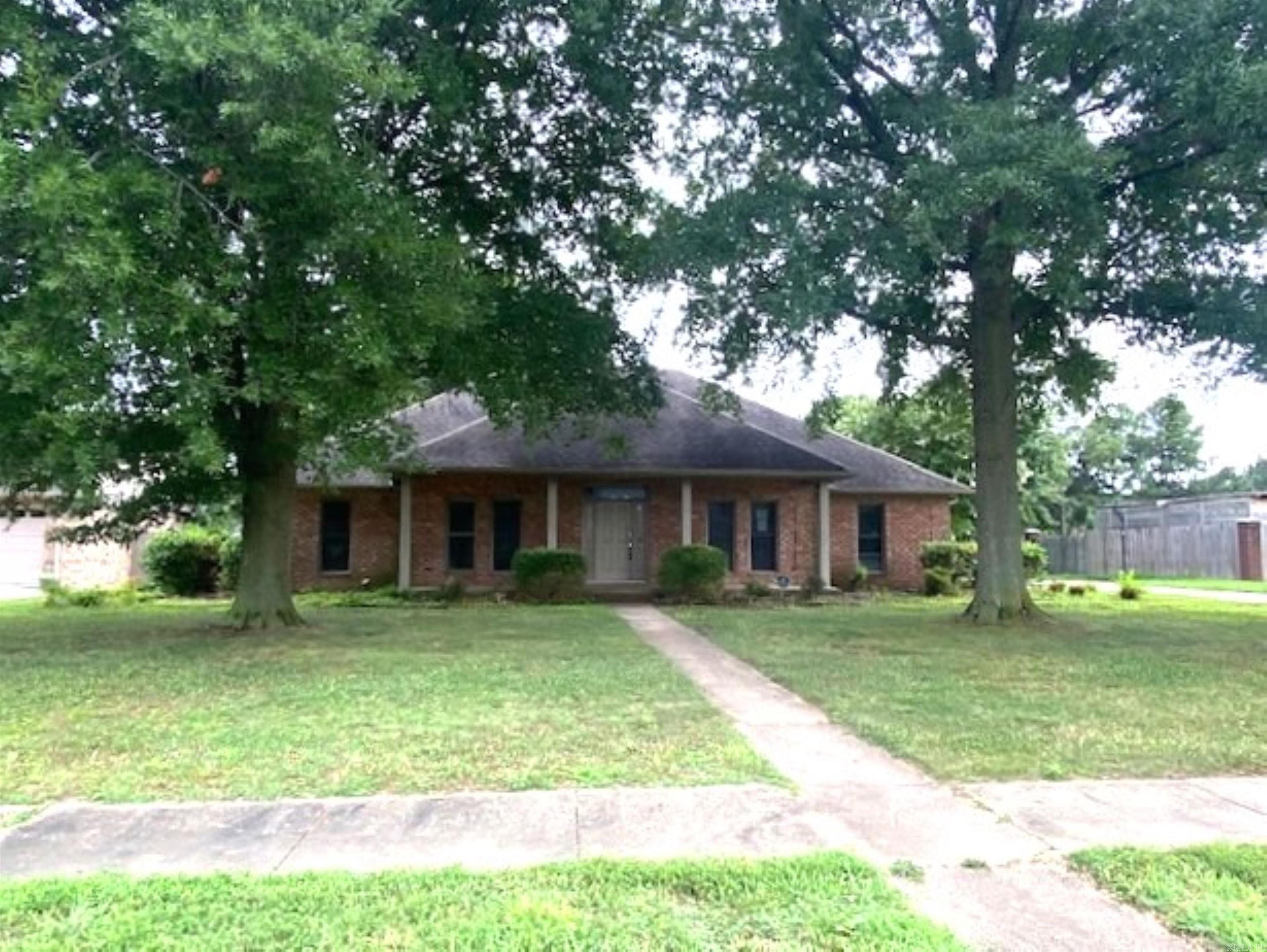 Just Listed!! This Large Sized Home Has Great Curb Appeal! Four Bedrooms-One Of Which Is The Primary With It's Bathroom. A Large Livingroom- Has Nice Ceiling, Formal Dining Room, Kitchen/Dining, Laundry Room & Garage. Home Is Very Spacious. It Also Has Covered Front & Back Porches-These Are Always Great Features. Home Sits On A Large Landscaped Lot. While Repairs Are Needed, This Would Be A Great Property To Customize With Your Own Style! Due to condition, the property may have health/safety risk(s). Prior to entry / access, all parties must sign a Hold Harmless Agreement and the property may only be shown by appointment.