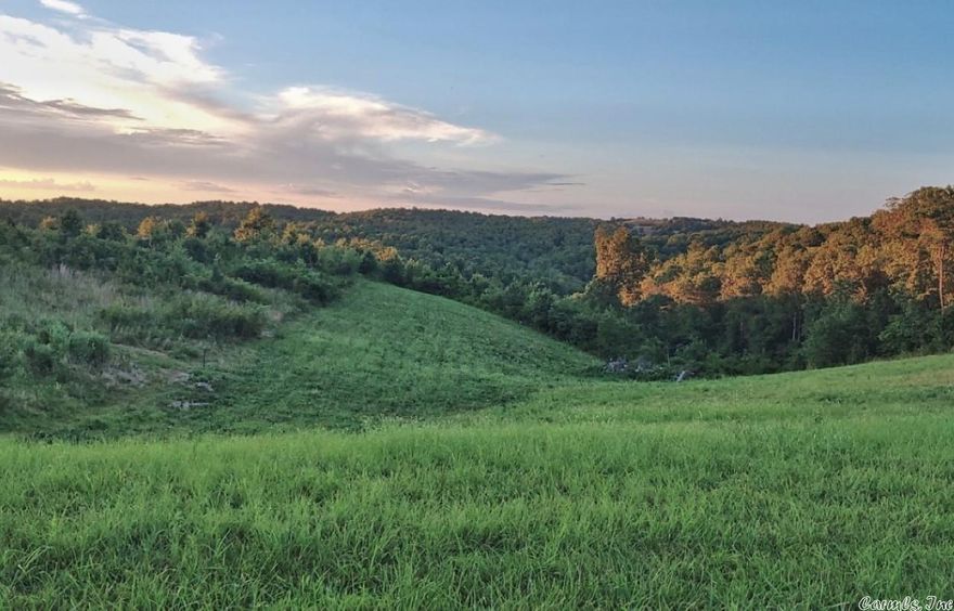 No 02154   Near the Buffalo River. 5.45 unrestricted acres.  Looking for a place to build or place an RV? Maybe install a manufactured home or small cabin? This property checks all the boxes.  Septic, water and power are installed.  There is a 12x32 concrete pad poured for RV or storage building, 2 water hydrants, and a power service pole.  With a year-round view and easy access along a low travel county road.  What could be more perfect! $39,500