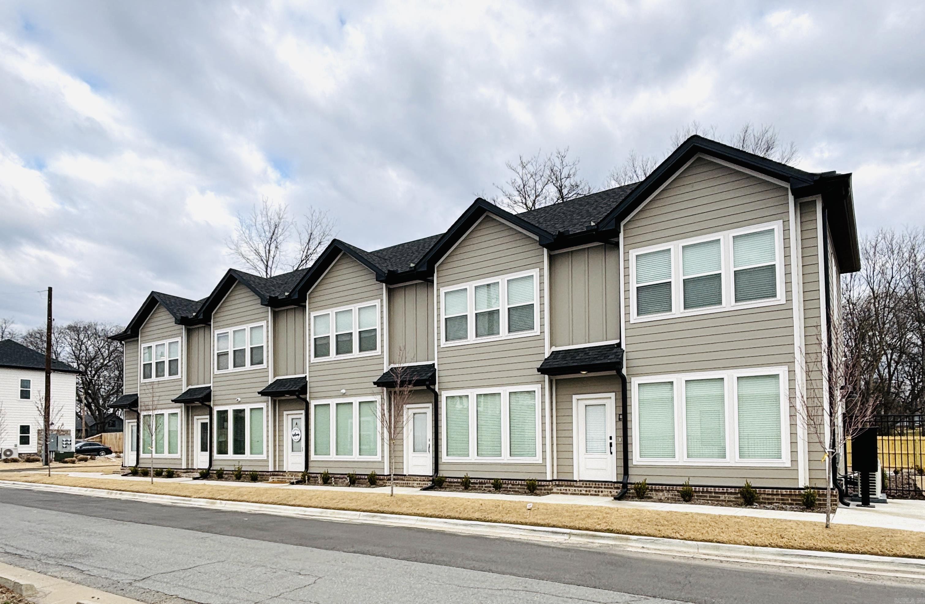 Discover an exceptional investment opportunity in the heart of Rockwater, the metro's most highly sought-after neighborhood. This brand-new 2024-built street-front five-plex offers modern design and premium finishes in a prime location. Each unit is thoughtfully designed for urban living, with contemporary interiors and high-end details. The property boasts 10 dedicated parking spots in the rear, ensuring convenience for residents. Just steps from the Rockwater Marina and Yacht Club, Simmons Bank Arena, the Argenta Arts District, and the upcoming state-of-the-art convention center, this property is positioned for long-term appreciation and strong rental demand. Experience the perfect blend of walkability, lifestyle, and investment potential in one of Central Arkansas' most vibrant communities. **Property Fully Occupied. No Showings Unless Your Offer Is Accepted.**