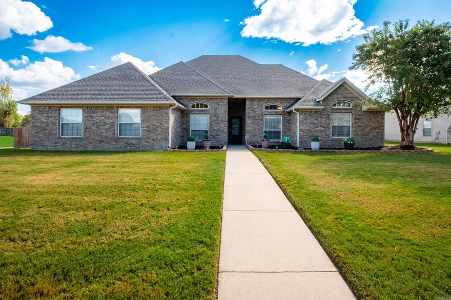 Welcome to this well-maintained 5 bedroom, 2 bathroom home situated on a large corner lot with a side-loading 2-car garage and full privacy fence. The inviting split floor plan offers both comfort and functionality, perfect for families and entertaining. Step inside to find a welcoming new fresh light neutral paint throughout, A living room with  a cozy gas fireplace, and a separate dining room. Kitchen comes complete with stainless steel appliances. The refrigerator, washer, and dryer to convey —making move-in a breeze. The primary suite is a true retreat with a large walk-in closet, dual sinks, and a relaxing jet tub. Outside, enjoy evenings on the covered back patio, overlooking your private fenced yard. Major updates provide peace of mind: roof (2022), HVAC (2024), water heater (2025), garage floor & garage door (2025). This home combines thoughtful upgrades, and a wonderful layout—ready for its new owners! For a limited time Seller is offering $5,000 in buyer concessions with acceptable offer. An American Home Shield home warranty will also be provided Agents see remarks