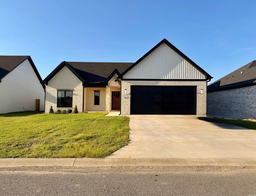 New to the market and you don't want to overlook this one!!  Built just last year, this home is the perfect blend of modern and farmhouse. The open-concept living room and kitchen is stunning, with vaulted ceilings and windows giving the space a light and airy feel while the exposed wood beams in the living area are a wonderful contrast to the beautiful white quartz countertops in the kitchen. In addition to the 3 bedrooms, there is a spacious walk-in pantry, a laundry room and an office/flex room.  You will find luxury vinyl plank flooring throughout the majority of the home, with tile in the bathrooms. The primary bathroom is equipped with a double vanity, a large soaker tub, and a beautifully tiled walk-in shower.   Out the back door, you will find a fully-fenced yard with plenty of room for kids or pets to run. And the covered back porch with additional concrete patio is the perfect place to hang a TV and throw some burgers on the grill this fall during game time!