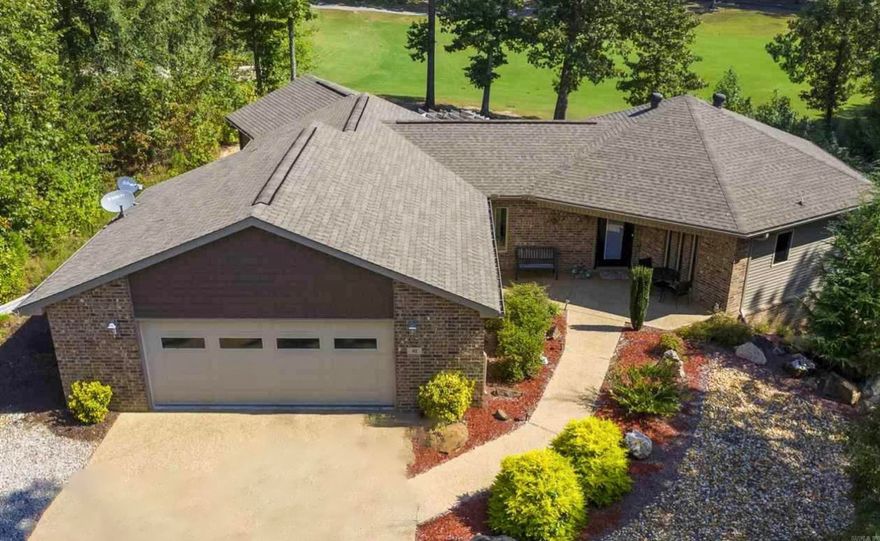 This beautifully updated and meticulously maintained golf course home is an architectural delight with design that captivates - volume ceilings and walls of windows circling around and flooding the space with natural light. Perfect to showcase park-like views of the 17th fairway and the professionally landscaped yard. This is an entertainer’s dream and the heart of the home is an expansive kitchen with two islands, two pantries, abundant prep space, ideal for gatherings. It flows seamlessly into the dining area and a grand great room, anchored by a cozy fireplace with fabulous views of the large covered deck and golf course. There is a “diner” style bar that adds even more character to the space. The main level also hosts a luxurious master suite with a fireplace, spa-inspired en-suite bathroom, and private access to a serene porch sitting area, plus an additional bedroom, full bathroom, and laundry. Downstairs, a private guest suite or potential rental retreat features a full kitchen, dining area, living room, bedroom, and bathroom, with French doors leading to a secluded porch—perfect for guests or extended family.