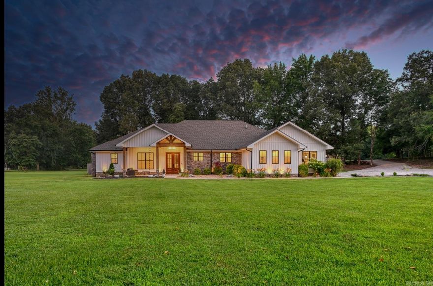Custom-built Craftsman-style home on 6.4 acres in the Brookland School District. A welcoming front porch with a vaulted wood ceiling sets the tone for this stunning property. Luxurious upgrades and attention to detail are evident throughout. The foyer opens to an office with 8-ft wood doors, while raised ceilings and 8-ft interior doors enhance the spacious feel. The vaulted family room features a floor-to-ceiling stone fireplace with a linear gas insert. The elegant eat-in kitchen boasts honed marble countertops, GE appliances, a pot filler, wet bar with an ice maker, and a hidden walk-in pantry. Designed for entertaining, the space flows into a second living area and out to a screened porch with a wood-burning fireplace and outdoor kitchen with a pellet grill. The serene primary suite offers a spa-like bath, while two guest rooms each have private baths. Additional features include a half bath, oversized three-car garage, large mudroom, laundry with custom dog-washing station, Generac generator, security system, smart home features, built-in speakers, and foam encapsulation for efficiency and comfort.