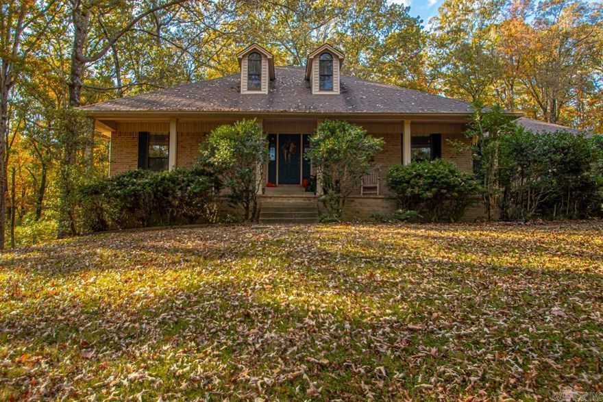 WELCOME TO YOUR PRIVATE OASIS!!! The love of NATURE abounds!! AWESOME PROPERTY! Home, Shop, Storage Shed, Gazebo, Wonderful multi-level decking. Trees all around! Not too far from town!! This is one for you to make your dream home!! All brick with brick wall separating drive & backyard area!! Large living area with high ceilings, built ins & gas log fireplace. Formal dining area & large eat in kitchen. Primary suite is separate from other bedrooms! Lighted driveway with private gate!!  Don't let this getaway!!