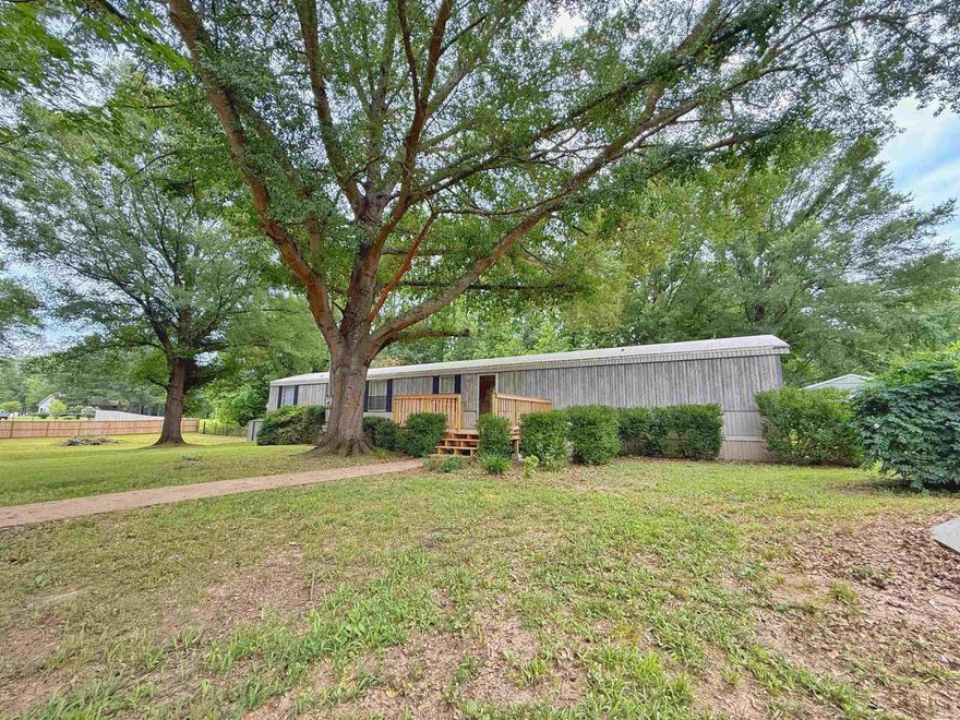 Discover this charming mobile home in Oppelo, Arkansas, set on a serene 1-acre dead-end lot adorned with large shade trees. Spanning 1,280 sq. ft., the thoughtfully designed split floor plan offers comfort and privacy. The inviting kitchen features a newer dishwasher and stove, perfect for easy meal prep and cleanup. Step outside to enjoy a spacious yard ideal for outdoor activities, alongside several outbuildings for extra storage or hobbies. A sturdy storm shelter ensures safety during possible severe weather, providing peace of mind. Not to mention the entire property is fully fenced, gated and includes a detached two car carport. Located in the Oppelo community, this home is a perfect retreat while still being close to local amenities being just approximately 15 minutes from Petit Jean State Park. Whether you're seeking a first home or a weekend getaway, this property is not to be missed! Schedule your tour today!