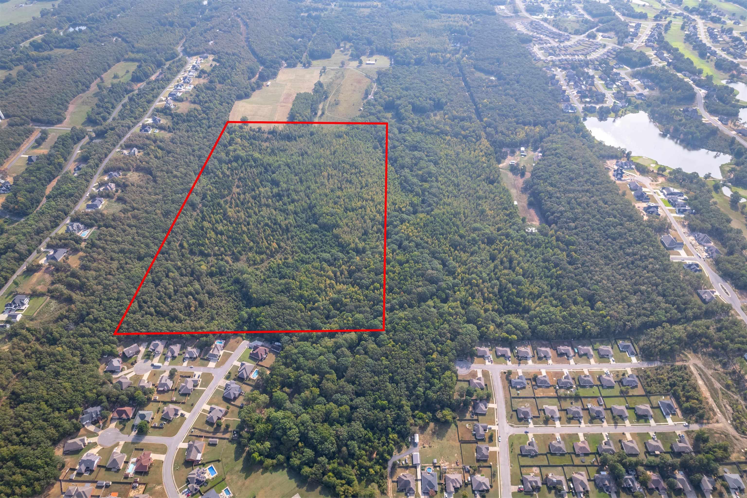 Ideal property with Approx 63.93 Acres to build a large or small subdivision, a family compound, or a private residence with acreage. Property borders Magness Creek neighborhood, Magness Creek "Creek" and Mountain Ranch Estates as well as easement access off of Bailey Rd. Main access point is from Lakeland Drive. Prior Engineering data exists for a platted subdivision too. Land is made up of tree covered hills, level areas and creekfront property. City Water, First Electric, City Sewer, and Gas are at property borders. See Agent Remarks.