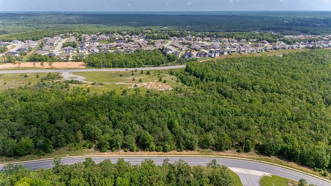 WOW! 1 +/- acres lot! Ready to build your dream home on! Lot has a beautiful creek that runs along the side. Beautiful trees! Pictures show entire acreage for sale. lots will be marked.