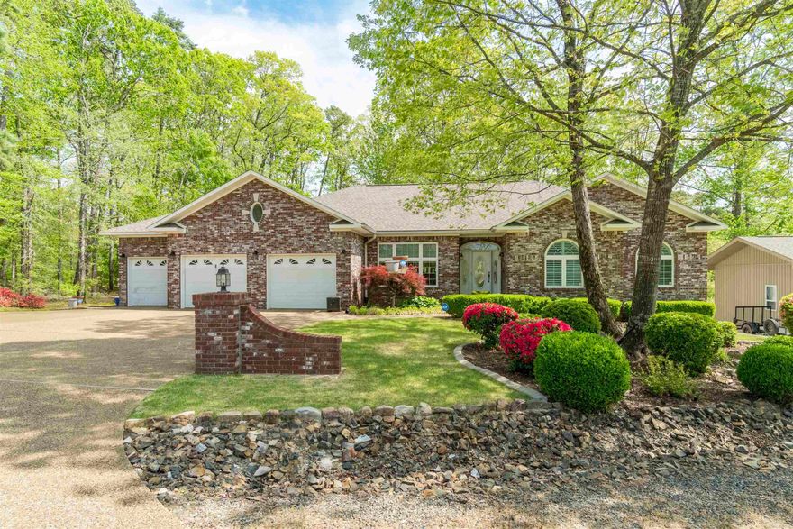 Enjoy peaceful living in this spacious and well-maintained 5-bedroom, 3.5-bath home offering seasonal views of Lake Balboa.  Situated on a level front lot with gently sloping back yard, this two-level home features a desirable layout with room for everyone.  Main entry level includes a comfortable living area with fireplace; central kitchen with stainless appliances, quartz counters and pantry; dining room; separate office; divided plan for privacy with primary and two guest bedrooms; 2.5 bathrooms and laundry.  The lower level has a large entertaining room with great wet bar and fireplace; two bedrooms and full bath; and 768 S.F. H/C workshop (not included in square footage).  Features of the home include a water softener system; central vacuum; irrigation system; two hot water heaters; custom ceilings; walk-in cedar closet; security system; two heat pumps (2025 and 2022); buried propane tank; and oversized 3 car garage that's perfect for storing all your belongings!  The adjacent corner lot next door is available for separate purchase--offering added privacy.  Roof replaced in 2023 adds peace of mind and value.  Come see all this lovely home has to offer!  See AGENT REMARKS.