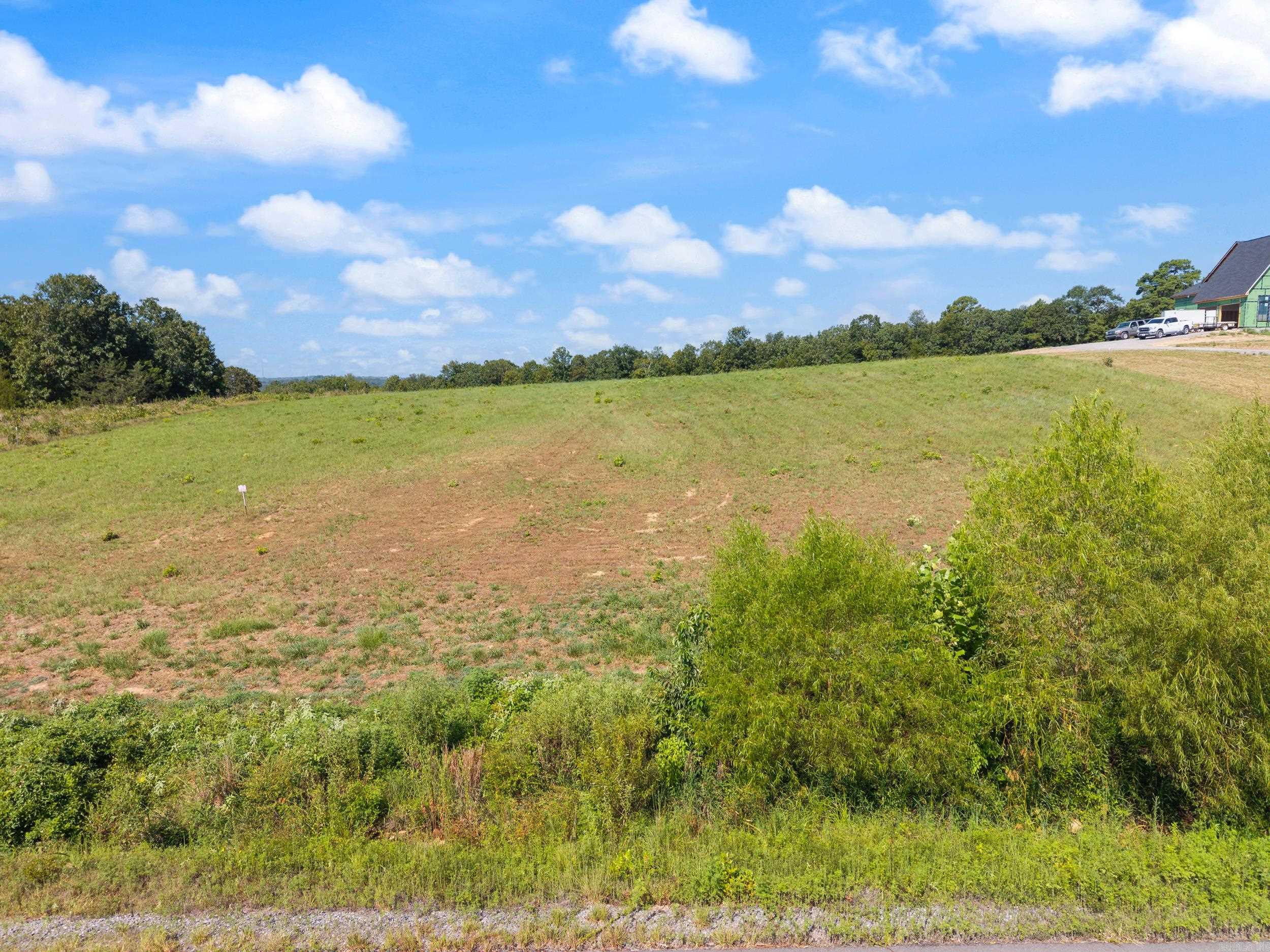 Build your dream home on this stunning 2.66-acre cleared lot in the desirable Woodridge Subdivision. Situated on Painted Sky Drive, the property lives up to its name with sweeping panoramic views that transform with each sunrise and sunset. Water, electric, and gas connections are available, and the minimum build size is 2,000 SF. Don't miss your chance to claim this beautiful lot and bring your vision to life!