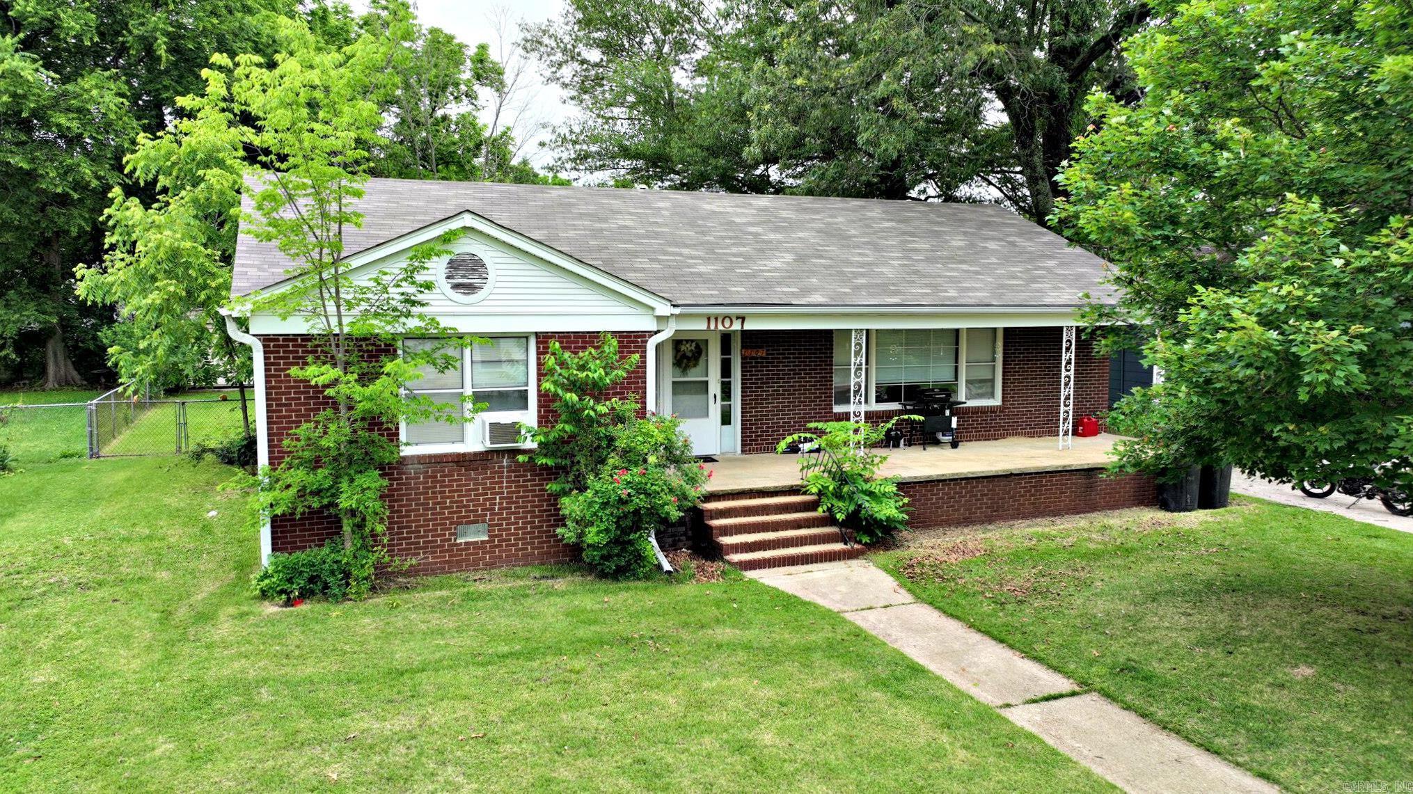 Timeless Charm in the Heart of Mena! This classic 3-bedroom, 2-bath home offers 1,632 sq. ft. of character, warmth, and potential. With a spacious kitchen, abundant built-ins, and a large laundry room complete with cabinetry, this home is designed for comfort and practicality. Step outside to find a couple of outbuildings perfect for storage or hobbies, and enjoy the peace of mind that comes with a brand-new roof. Ideally located near Janssen Park and the area’s exciting new bike trails, this property offers a blend of old-world charm and modern convenience. Currently serving as a rental property, it presents an excellent investment opportunity or a welcoming place to call home. This well-loved home truly stands the test of time—come and see for yourself!