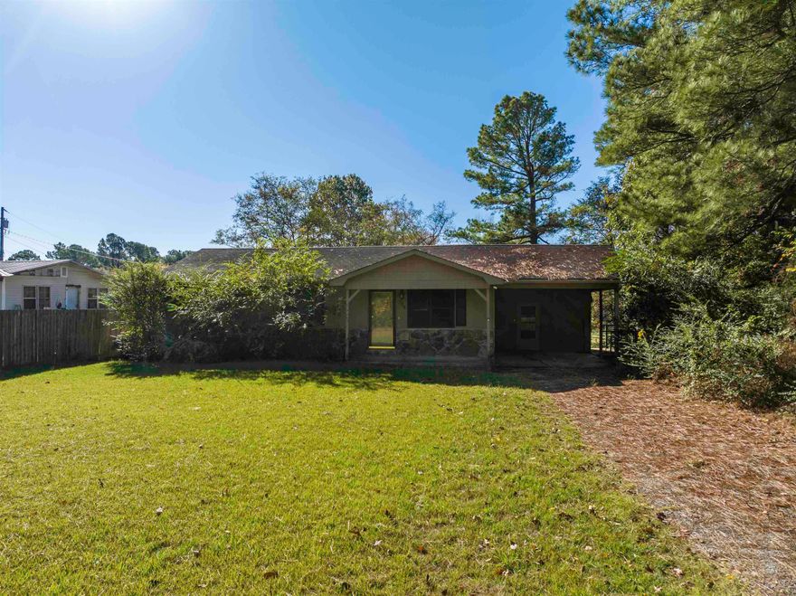 Welcome to your serene city retreat! This charming home offers the peaceful ambiance of country living, all within city limits. Inside, you'll find three cozy bedrooms and a full bathroom. The seamless flow from the kitchen to the living room creates an ideal space for family gatherings and entertaining friends. Enjoy the convenience of a sizable laundry room. washer and dryer, which are included with the home. The decent-sized, fully fenced backyard provides a secure outdoor space.