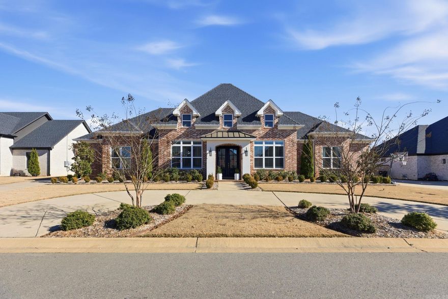 Beautiful “like new” home built with New World materials and craftsmanship, thoughtfully designed with timeless Old World charm. This spacious 5-bedroom, 4.5-bath residence sits on a large, level lot in one of Benton’s most sought-after neighborhoods.  The home features stunning wood floors throughout the main living areas, carpeted bedrooms, and tile in all wet areas. The state-of-the-art kitchen offers a large island, double ovens, and a gas cooktop, perfect for entertaining and everyday living. Formal dining room plus a spacious living room with a beautiful fireplace provide inviting gathering spaces, while a secondary sitting room features an additional brick fireplace for added warmth and character.  The large primary suite includes a stunning en-suite bath designed for comfort and relaxation. A generous bonus room with its own full bathroom and closet offers flexibility and can serve as a 5th bedroom, guest suite, or private retreat.  Combining space, quality, and classic design, this exceptional property offers luxury living in a prime Benton location.