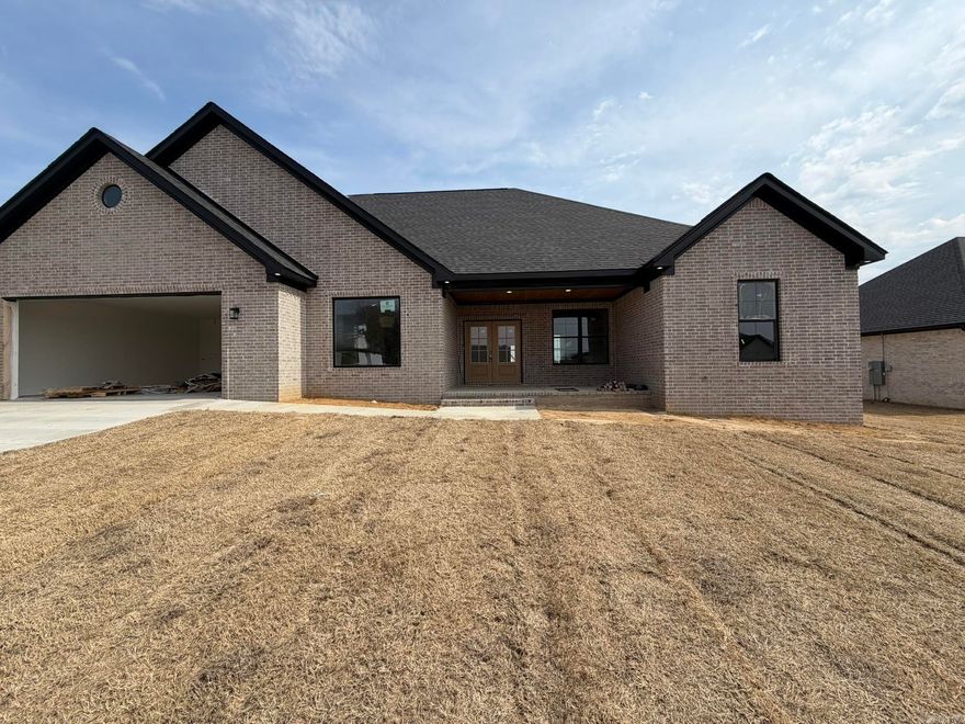 New Construction in Belmont Estates - Searcy, AR! This 4-bedroom, 2.5-bath home offers 2,474 sqft of timeless design with a fresh, modern edge. You’ll love the open split floor plan with LVP flooring throughout, a kitchen featuring a gas range, quartz countertops, soft close cabinets/drawers, and a spacious walk-in pantry — all flowing into a living area centered around a stunning floor-to-ceiling stone electric fireplace. The laundry room includes extra storage space, lockers that passes through to the primary suite side first starting with the closet, then bathroom that features a walk-in tile shower, soaker tub, double sinks, lighted mirrors boasting with natural lighting. Other features of the house include gas heat, gas tankless water heater to add extra efficiency to everyday living. Enjoy quiet evenings or weekend gatherings on the covered back patio! Reach out today for details or to schedule a private tour! 2 10 Year special builder warranty. Estimated completion date mid March 2026.