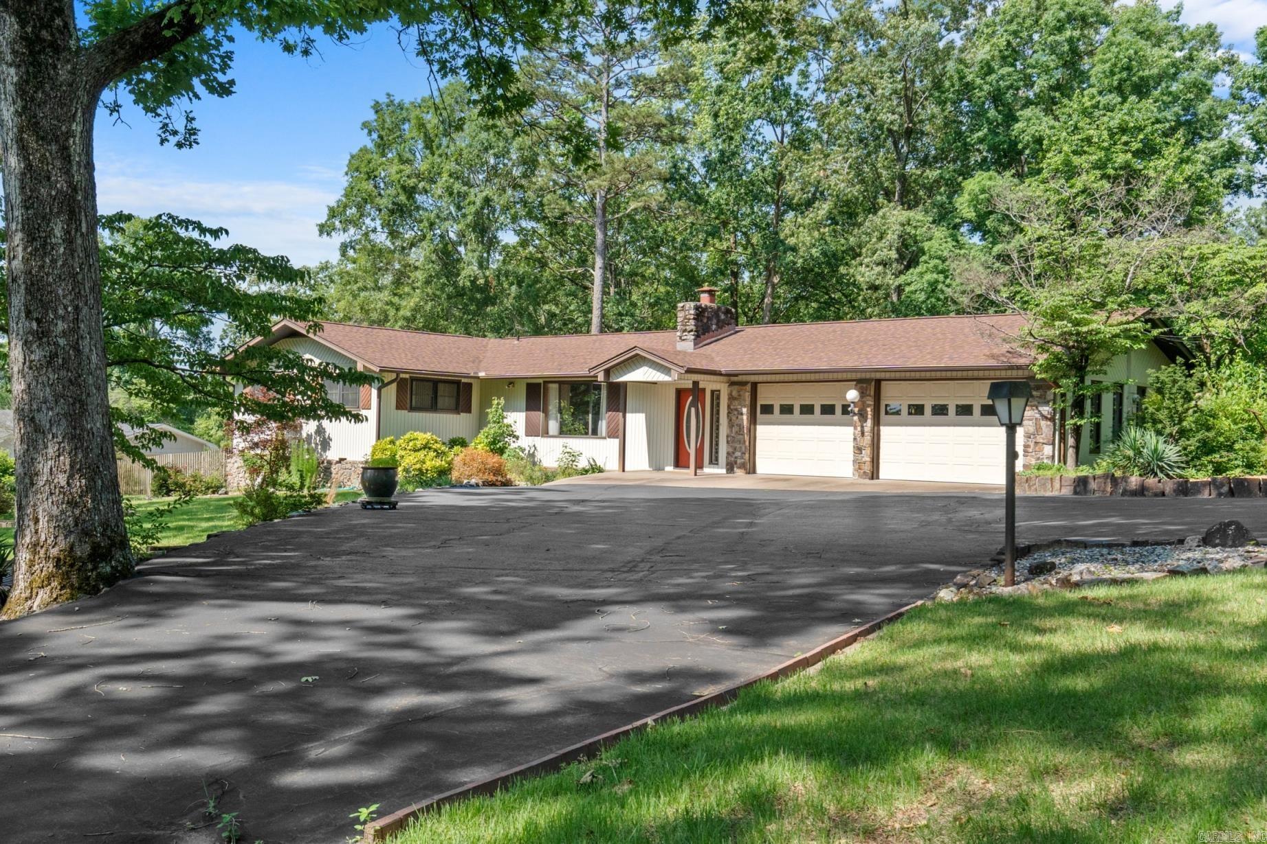 Lake Hamilton School District with room to grow and room to roam! This large family home boasts an open floor plan perfect for entertaining. The kitchen flows into a large dining area that opens to the living room and onto the family den that overlooks the covered patio and back yard. A large workshop with covered outside storage is perfect for overflow storage and hobbies. Situated on 3 acres, natures lovers - this is the place for you...complete with a pond just waiting for a day of fishing and picnics. Call today for your tour.