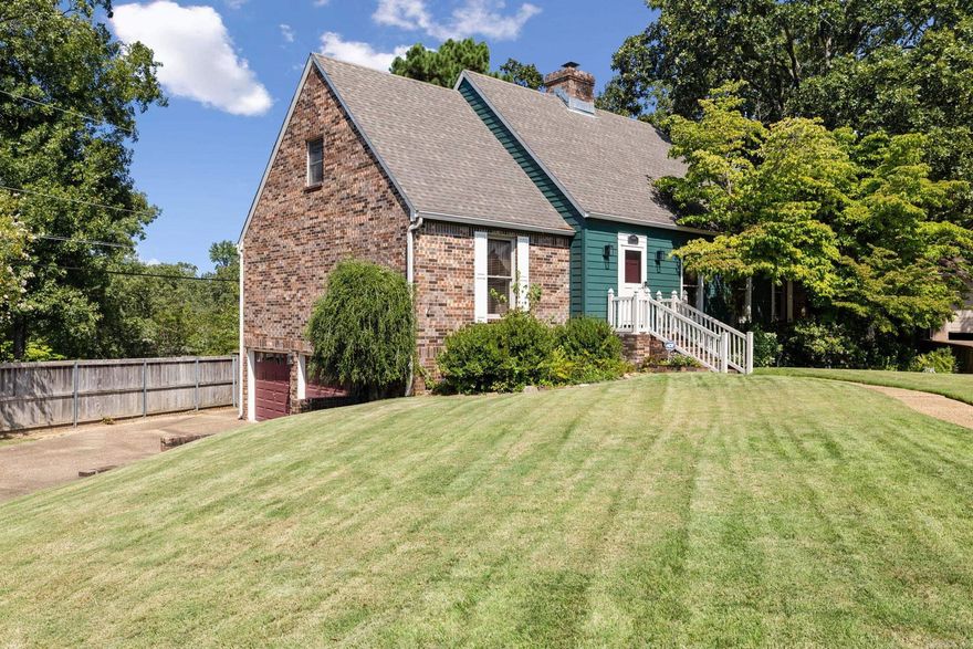 Settle into this beautiful custom-built home in the heart of North Little Rock. Featuring 4 bedrooms, 2.5 bathrooms, and over 2,439 sqft of living space on main levels, and over 500 sqft of additional partially heated and cooled space in the basement, this one-owner property has been lovingly maintained and is ready for its next family.  Step inside and be greeted by the warmth of original wood trim and solid wood doors and windows, paired with a true brick, wood-burning fireplace that creates a cozy focal point. The home offers real brick flooring, generous living spaces, and ample storage throughout.  Set on a large, beautifully landscaped corner lot, the property provides both privacy and charm. Enjoy quiet mornings or gatherings with friends on the patio, or take advantage of the workshop space in the basement for hobbies, projects, or extra storage. A 2-car garage adds convenience, while the quiet street makes this location ideal for peaceful living.  This meticulously cared-for home offers timeless character, thoughtful design, and unbeatable charm—truly a rare find in North Little Rock.