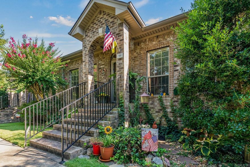 Extremely well maintained townhome with 2 bedrooms 2 full bathrooms, hard wood floor with granite in baths and kitchen, carpet in principle bedroom, crown molding, ceiling fans, gas log fireplace, motion sensors in house and at front with outdoor light, microwave and washer/dryer stay, hot water heater replaced Feb 2023, AC coils replaced March 2023, deck painter June 2022. 2 car garage. HOA covers sprinkler system, insurance for exterior, trash pickup and all lawn maintenance. See Agent Remarks