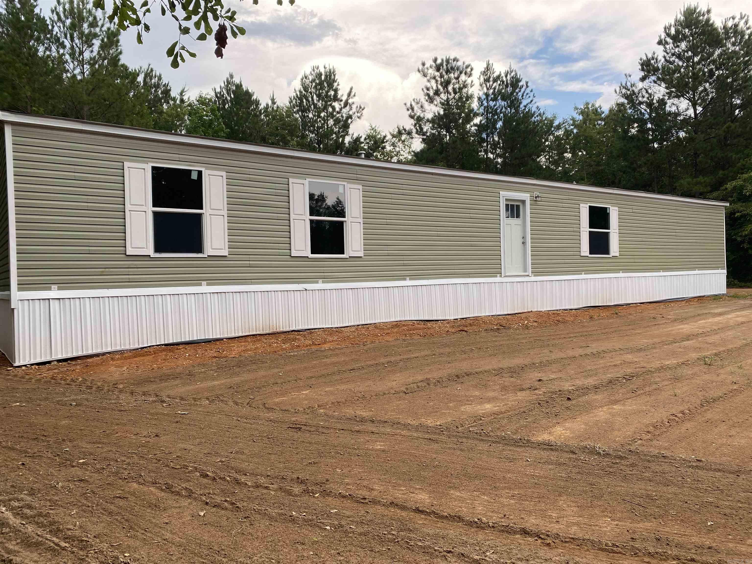 This home is on8.8 acres just waiting for someone to move in and make it there own. The home has never been lived in and is waiting for your personal touch. Very private location for those that like their privacy. The manufactured home is an open floor plan with Kitchen that opens to Family Room. The kitchen has new stainless appliances. Bedrooms have carpet and are a nice size. This property has had clearing done. Plenty of potential for whatever your dreams may be.