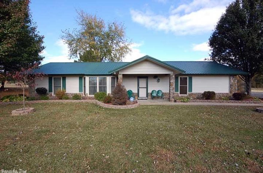 THIS PROPERTY HAS MANY UP DATES NEW WINDOWS, METAL ROOF 30 X 30 WORKSHOP WITH HEAT AND COOLING,TWO OVERHEAD DOORS PLUS WALK THROUGH DOOR , TILE AND LAMINATE FLOORING DISHWASHER SEPTIC SYSTEM, CEILING FANS, TWO  INCH FAUX BLINDS , KITCHEN SINK AND FAUCET , NEW BACK SPLASH IN KITCHEN , HEAT AND AIR APPROX 10 YRS OLD AND HOT WATER HEATER APPROX 5 YEARS ,  THE WASHER DRYER AND REFRIGERATOR WILL ALSO CONVEY  THIS PROPERTY HAS A LIVING AREA AND A DEN AND ALSO A CARPORT