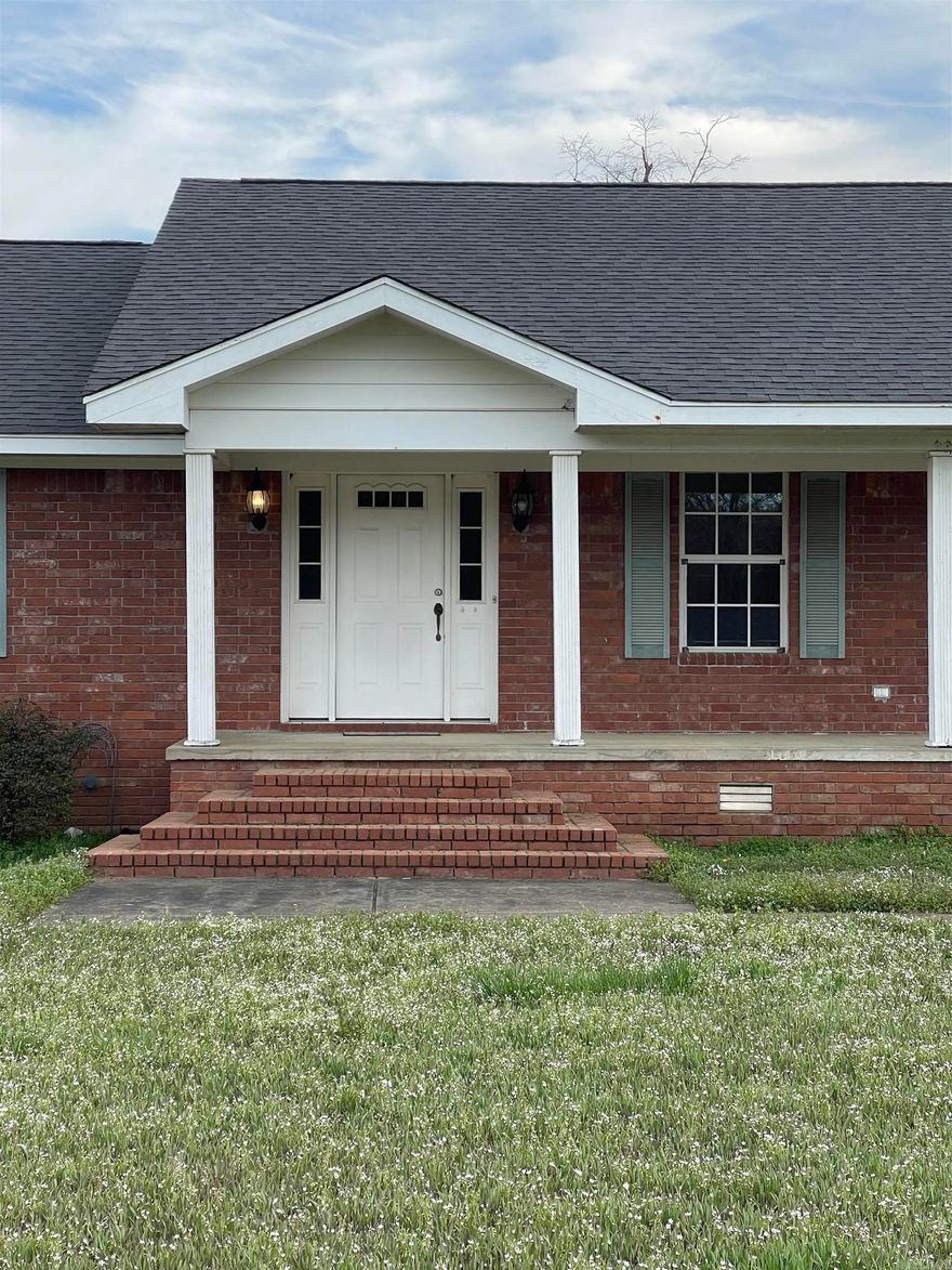 Here’s your chance to lease this spacious home on 2 acres! Great layout with three bedrooms and two and a half baths. Kitchen is ready for you to enjoy cooking with gas stove, microwave, dishwasher, fridge, and big pantry. Sink looks out to the back yard, and kitchen is open to the dining area. Living room has a built-in book case. Great size bedrooms with walk-in closets! You’ll love the work space in the garage. Just off the garage is a laundry room with built-in desk and separate half bath. Washer and dryer stay! Lots of natural light pours into the windows throughout the home. Lots of extra storage. Yard is fully fenced. Ready for your rocking chair on the covered front porch!  To schedule a showing, apply at www.mpcrpm.com