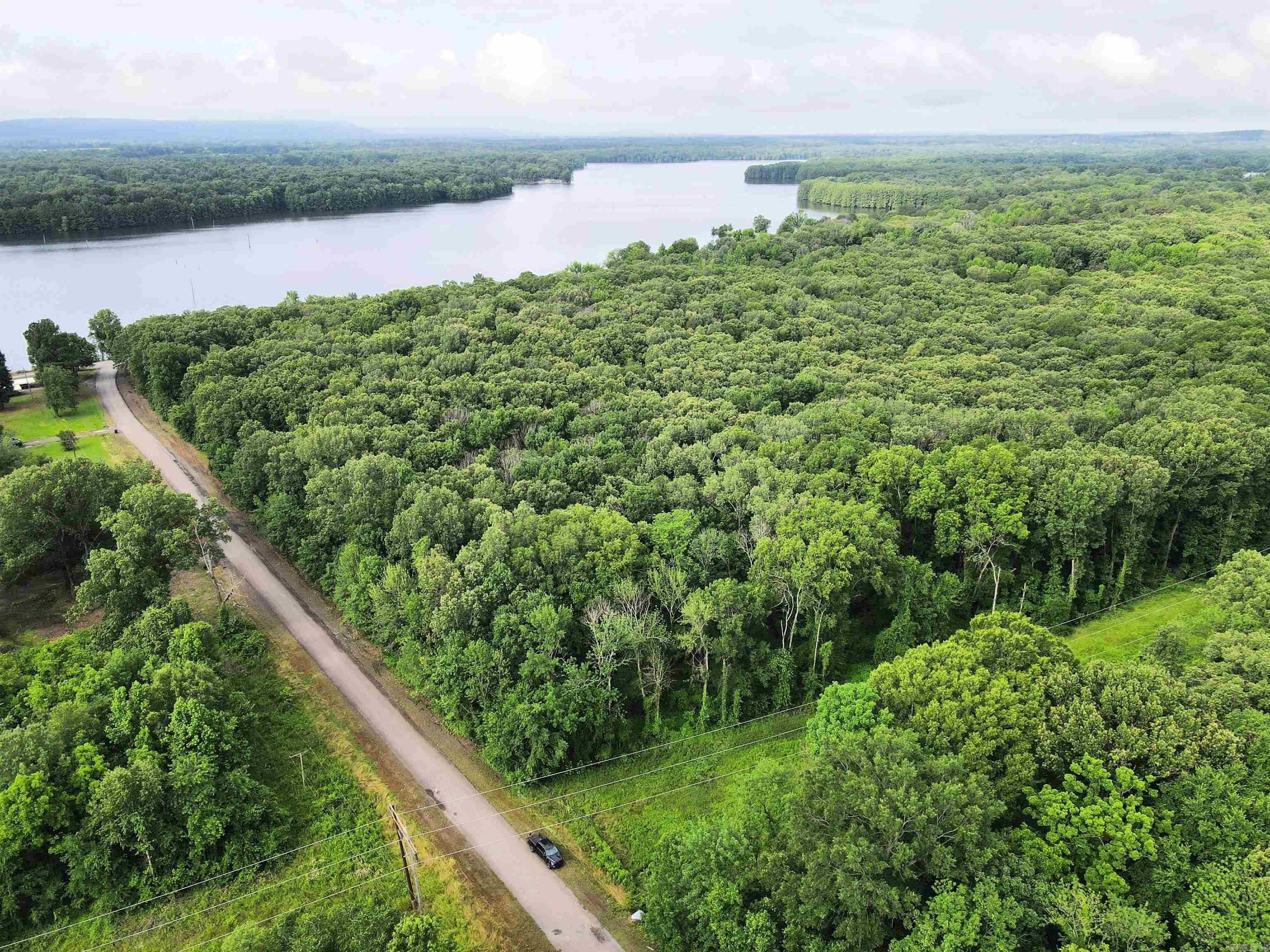 - 52 +/- acres of timber - 5 +/- acres of pasture - Numerous build sites - Utilities near the property - Mature mixed hardwoods - Heavy mast producing trees - County road frontage - Gently sloping topography - Small creek - ¼ miles to Atkins City Limit - 10 miles to Russellville