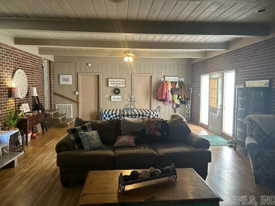 Spacious five bedroom and three full baths on half of an acre. It has an oversized den approx. 800 sq feet, that is great for entertaining. It has a separate dining area with four large picture windows that allows ton of natural light. Both the den and the dining room have woodburning fireplaces. Master bedroom and Master bath too have large picture windows. It also has an office, laundry room and large storage room. The half-acre is mostly clear, flat, partially fenced, and has a three-car carport. New roof, about two and a half years old.  Great home for large/ growing family or would make a great investment property as a hunting lodge.