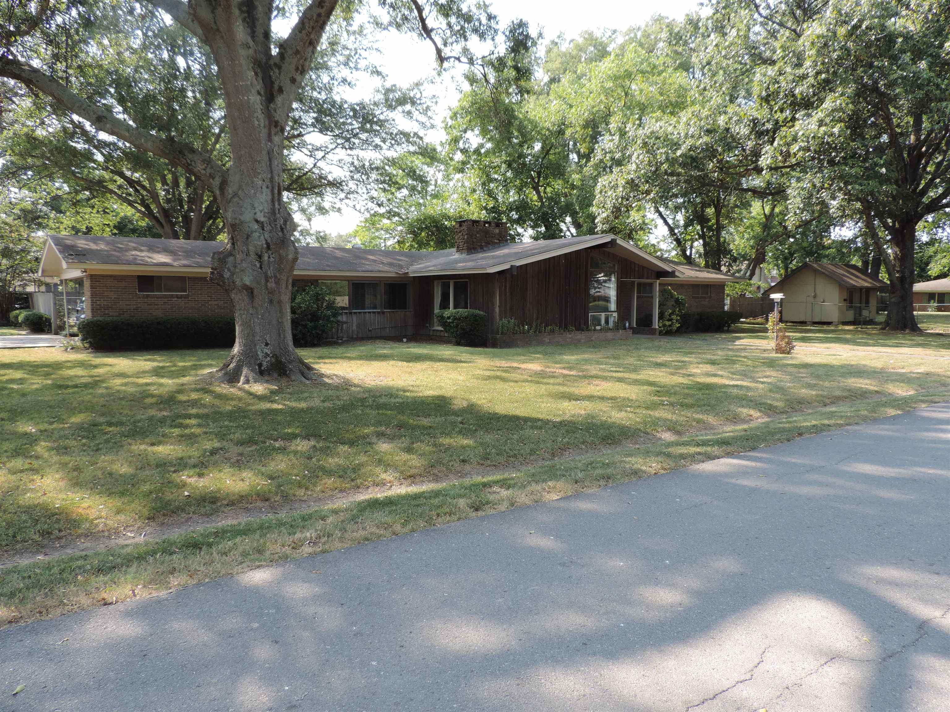 Spacious Home on a Large Corner Lot with Endless Potential! Situated on two lots, this beautiful property features fresh paint, new doors, and a large formal living room and dining room centered around a stunning stone double-sided fireplace with vaulted ceilings. The home offers spacious rooms throughout, including a generous master bedroom with direct access to the outdoor patio. Enjoy relaxing in the screened-in sunroom or entertaining on the expansive patio area. A standout feature is the separate 864 sqft building on the propertyāperfect for a guest house, mother-in-law quarters, office, studio, etc! This versatile space includes a large open area, kitchenette, and full bathroom. Outside, youāll find a full tennis court, a utility shed, and ample room for all your outdoor needs. This home is a one of a kind and one you do not want to miss out on! Call today and schedule your personal showing!