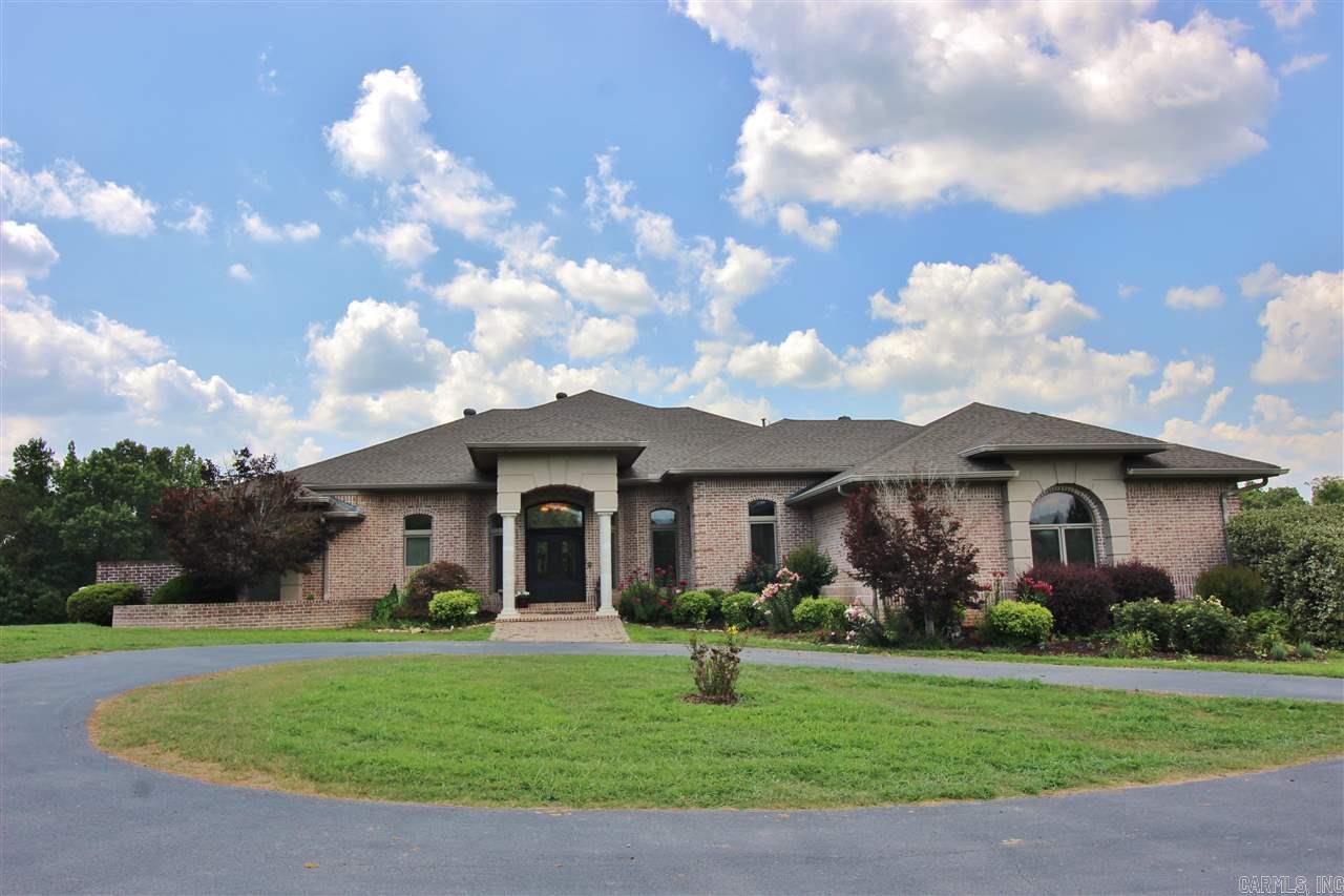 WOW..LOOK NO MORE!!Amenities include: Approximately 5137 sf,3 Bedrooms,3 Full Bathrooms,2 Half Bathrooms, Family Room, Hearth Room, Formal Dining Room, Large Master Bedroom w/sitting area, Laundry Room, Office/Study, Game Room, Nice Kitchen/Breakfast Area, 3 Car Garage, Large Deck overlooking land, 50'x100' Shop (50'x50' portion enclosed & other is covered) Beautiful tree shaded 40 acre yard/pasture land that adjoins the Saline River, Fenced and Cross Fenced, Benton Schools, And Much More.To much to List!!
