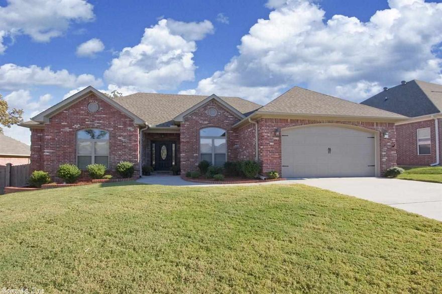 This exquisite custom built home features hand scraped hardwood floors w/extensive crown molding & trim. Eat-in kitchen w/custom built maple cabinets, granite counter tops, breakfast bar & stainless steel appliances. The formal dining and great room offer the perfect space to entertain or just unwind. Master suite includes a relaxing bath with double vanities, a walk in shower, jetted tub and a huge walk in closet with built in's. Out back you will find a huge, level lot with a covered porch. A Must See!!