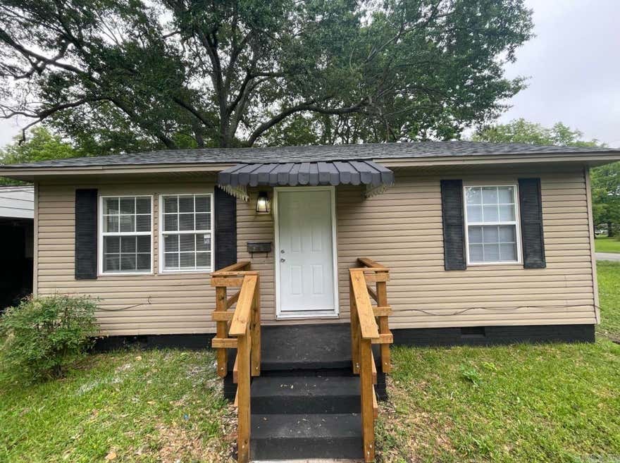 Completely remodeled and move-in ready! This charming 2 bedroom, 1 bathroom home offers 720 sq ft of updated living space with modern finishes throughout. Renovated from the studs, this home features updated flooring, fresh paint, an upgraded kitchen with stylish countertops, subway tile backsplash, and modern cabinetry. The bathroom has been beautifully updated with a sleek tiled shower surround and contemporary fixtures. Enjoy the warmth of the hardwood floors, spacious bedrooms, and a bright, open feel throughout the home. Perfect for a first-time homebuyer, downsizer, or investor looking for a turnkey property. Conveniently located and packed with updates, this one is a must-see!