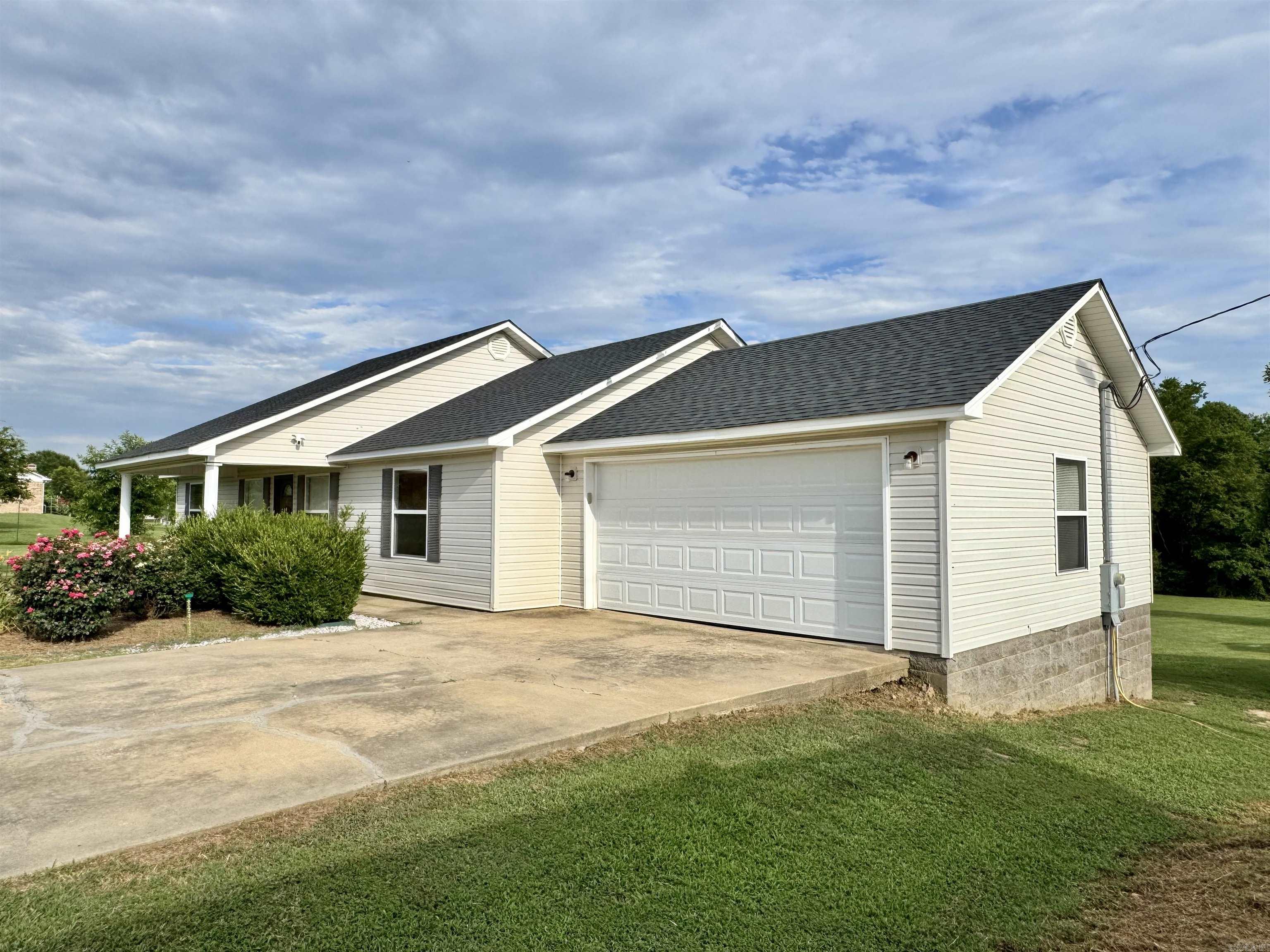 Sitting on 3 beautifully manicured acres, this home checks all of the boxes! Featuring a large living room with vaulted ceilings, a custom tile shower in primary bath, a 10x30 heated and cooled shop and a 40x50 camper pad with 50 amp RV plug. The large deck across the back provides the perfect spot to enjoy the local wildlife. All electric. Situated just minutes from Bismarck School and Lake Degray. Enjoy the privacy and feel of country living while still being close to Hot Springs and Arkadelphia. 2 car garage.