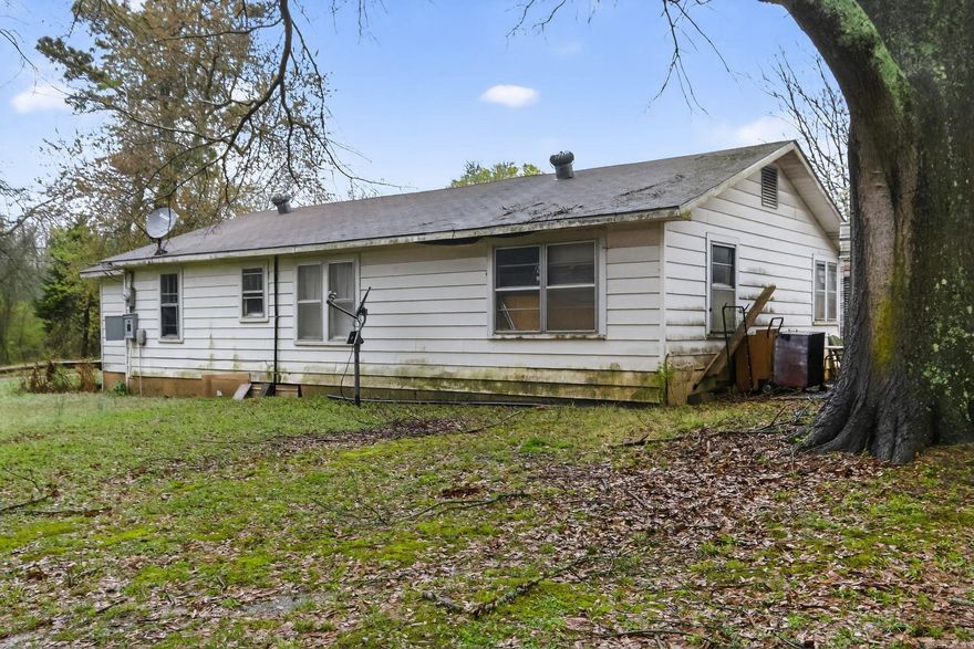 Check out this home a 3 bed 2 bath home on approximately 1 acre.
