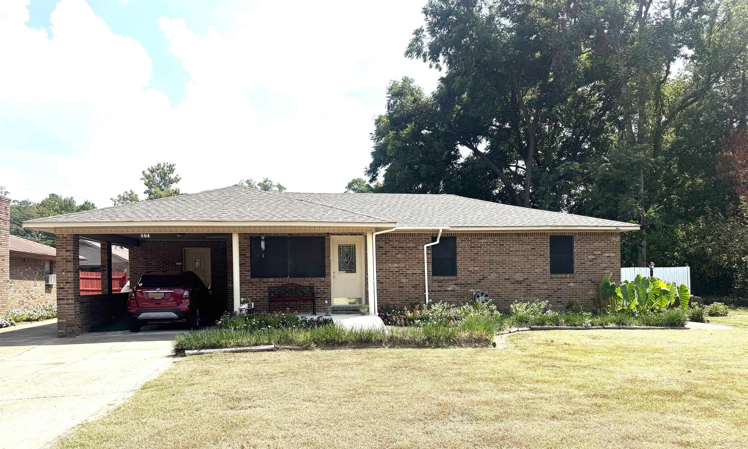 This well maintained 2 BR, 2 bath brick ranch home offers the perfect blend of comfort, functionality and outdoor space. Situated on a generous lot with large backyard, it is ideal for anyone seeking to relax, entertain, or work from home. Inside you'll find a spacious family room with a gas fireplace (Gas is not connected at this time.) The layout includes 2 comfortable bedrooms and 2 full baths, one which has a walk-in shower. Recent updates include roof, water heater, HVAC and fresh paint, giving you peace of mind for years to come. Outside you can enjoy a nice patio, partially wood fenced yard and 1 car carport with extra parking pad - great for guests, trailers or extra vehicles. An impressive 20 x 30 heated and cooled shop and a separate storage building are in the backyard. Don't miss this rare combination of comfort, updates, utility and affordability.