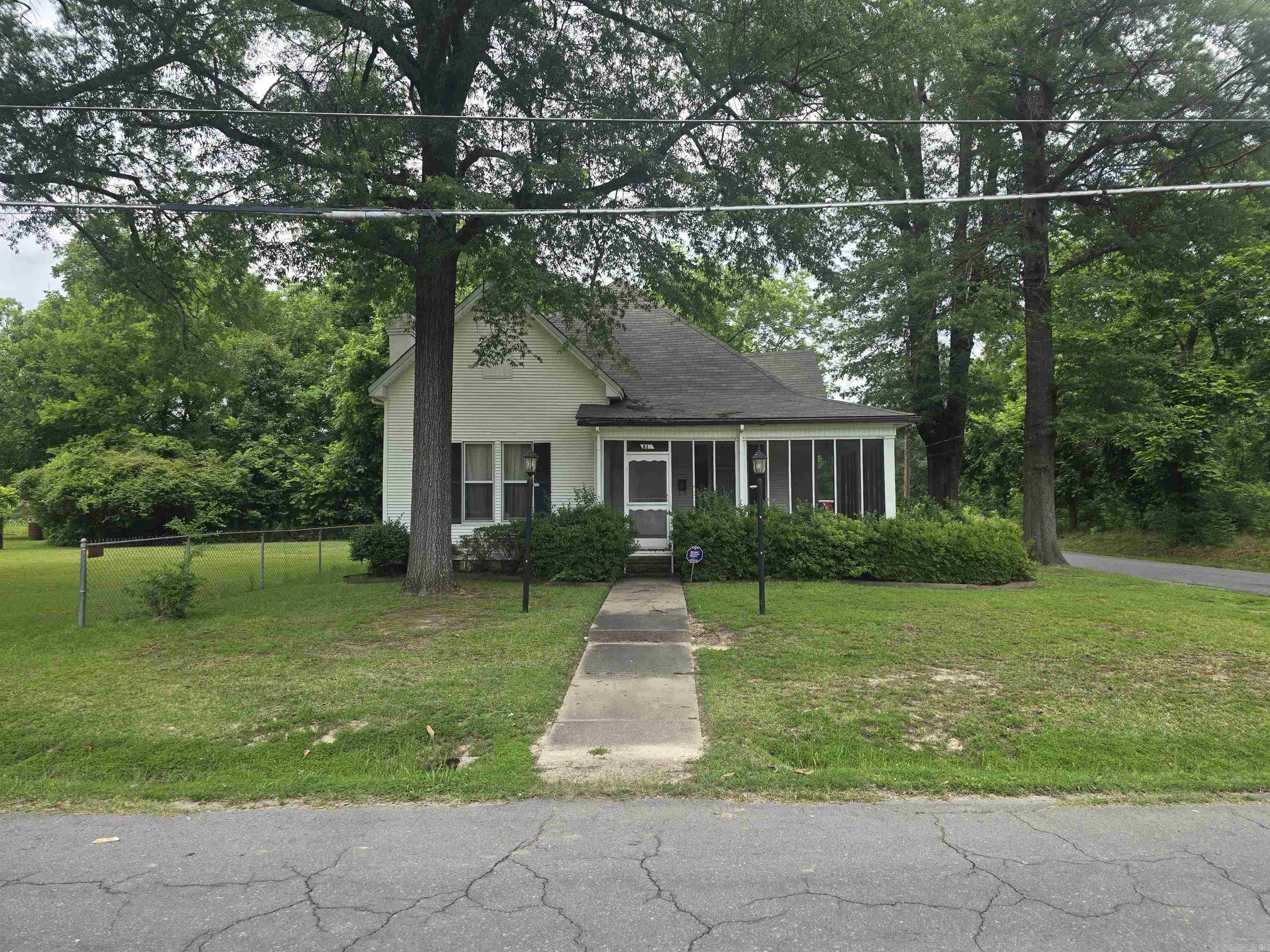 Charming and well-maintained 2-story, 3 bed, 1 bath home on a spacious corner lot! Features include central heat and air, formal living room, cozy den with wood-burning fireplace, separate dining room, and a screened-in front porch. Also includes a detached 2-car garage with ample upstairs storage. Sale includes the adjacent lotāoffering two full house lots on the corner for extra space or future potential.