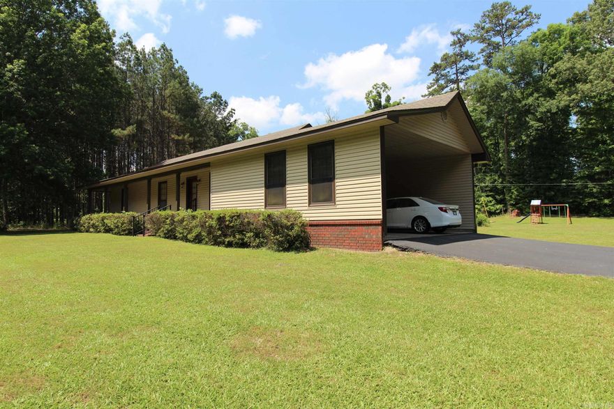 Hard to find a house in town on 4.6 acres with amazing SHOP*SO PRIVATE and land is gorgeous*super unique*nice size kitchen with walk-in pantry*woodburning stove*large living room with vaulted beamed ceiling*all bedrooms have walk-in closets*siding put on house in 2015*roof around 14 years old*HVAC 13 years old*vinyl plank flooring around 2 years old*insulated shop 60x30 shop built by Arkla-Tex 7 years ago*shop has HVAC and 1800 sft with a little over half is living area including a full bath*shop had 10 x 60 front porch*there is an additional metal building that is around 1 year old*no SPD-heirs do not live here*paved driveway*well maintained*wire for generator*LOCATION LOCATION LOCATION*additional acreage available-call for details*