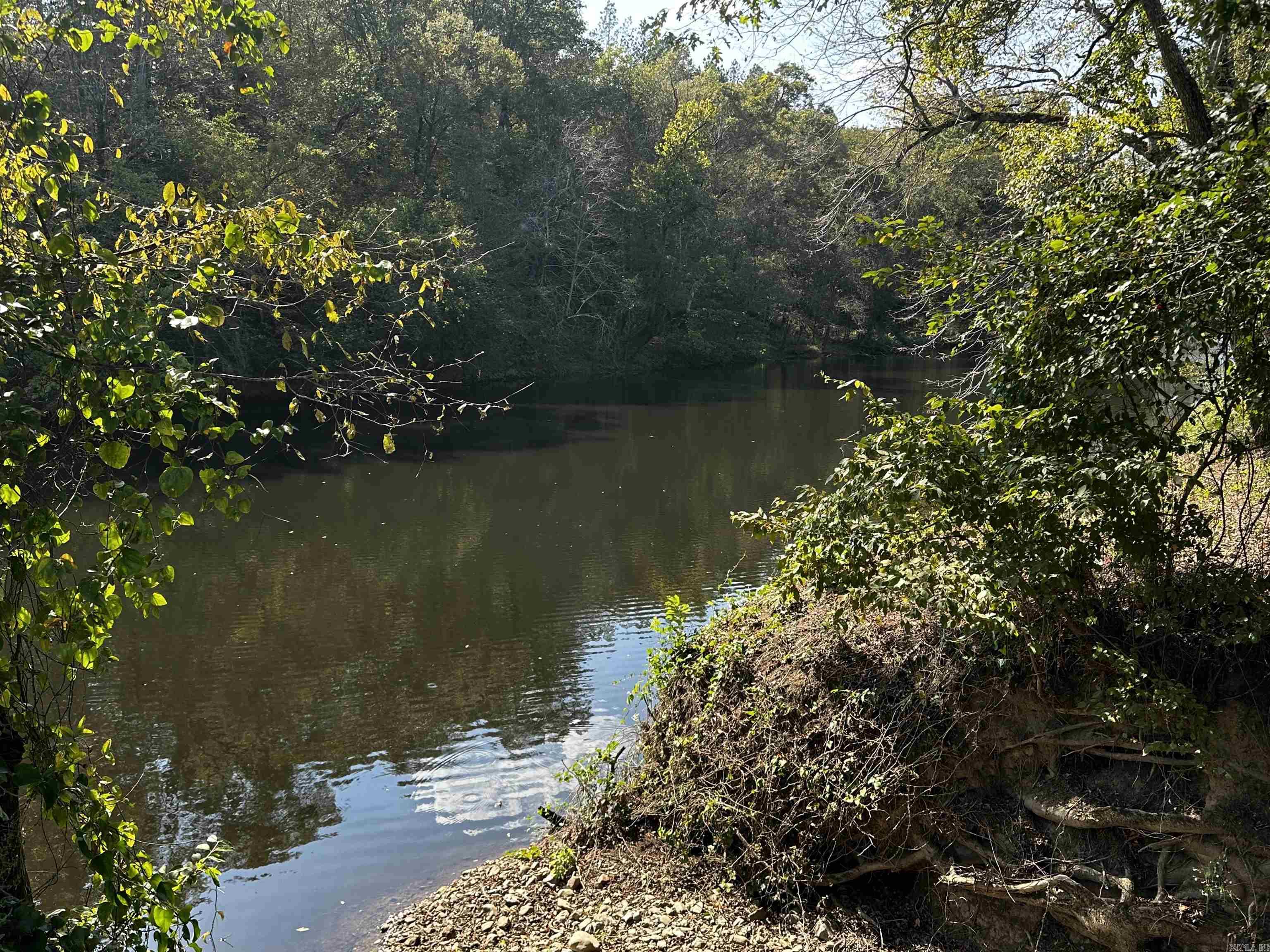 195 feet of beautiful River frontage! Reva's Retreat is surrounded by the National Forest and Irons Fork Creek, 1 mile N of Lake Ouachita + 2 mi. from Launching ramp. The beautiful 100 acre development offers seclusion, unblemished, back-to-nature, spacious lots - water frontage & River access w/some restrictions, incredible views, and underground electric. Fishing, kayaking, swimming, nature walks + trailhead for hiking are nearby, as well as amenities at HSV & Mt. Ida. Every day is a vacation with Peace and Quiet. This property is located in Reva's Retreat.