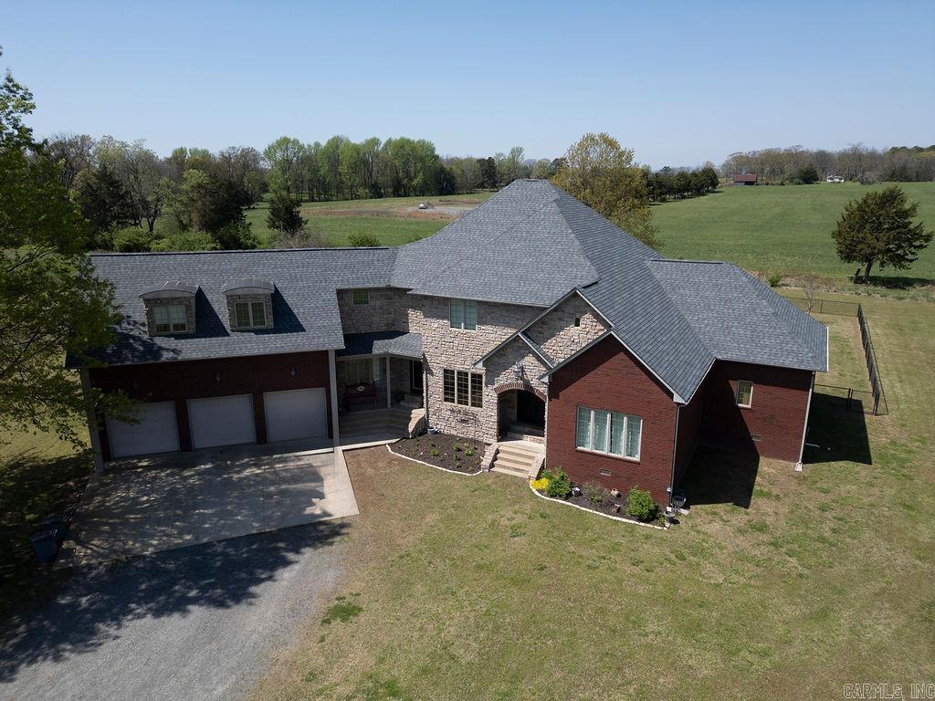 NEW ROOF JUST PUT ON!! NEW HVAC INSTALLED IN SUMMER OF 2024. ENERGY EFFICIENT HOME. This charming country home sits on a spacious 3-acre lot, offering a perfect blend of comfort and privacy. Featuring five generously sized bedrooms and three bathrooms, the home provides plenty of space for a growing family or those who enjoy hosting guests. A dedicated office allows for a quiet and productive work-from-home environment. The fenced yard ensures both security and privacy, creating an ideal space for children, pets, or outdoor gatherings. For relaxation or entertainment, a covered patio extends the living space outdoors, making it perfect for enjoying the peaceful country setting.